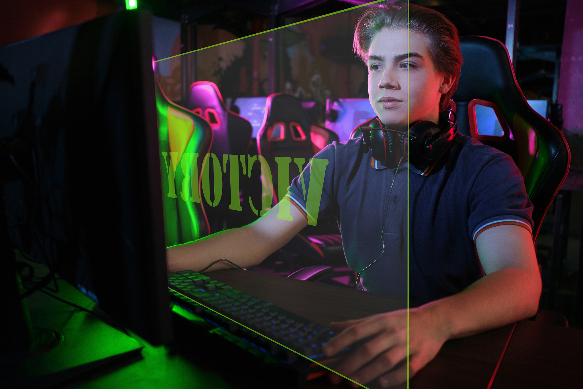 professional young caucasian gamer playing online on his pc. he 