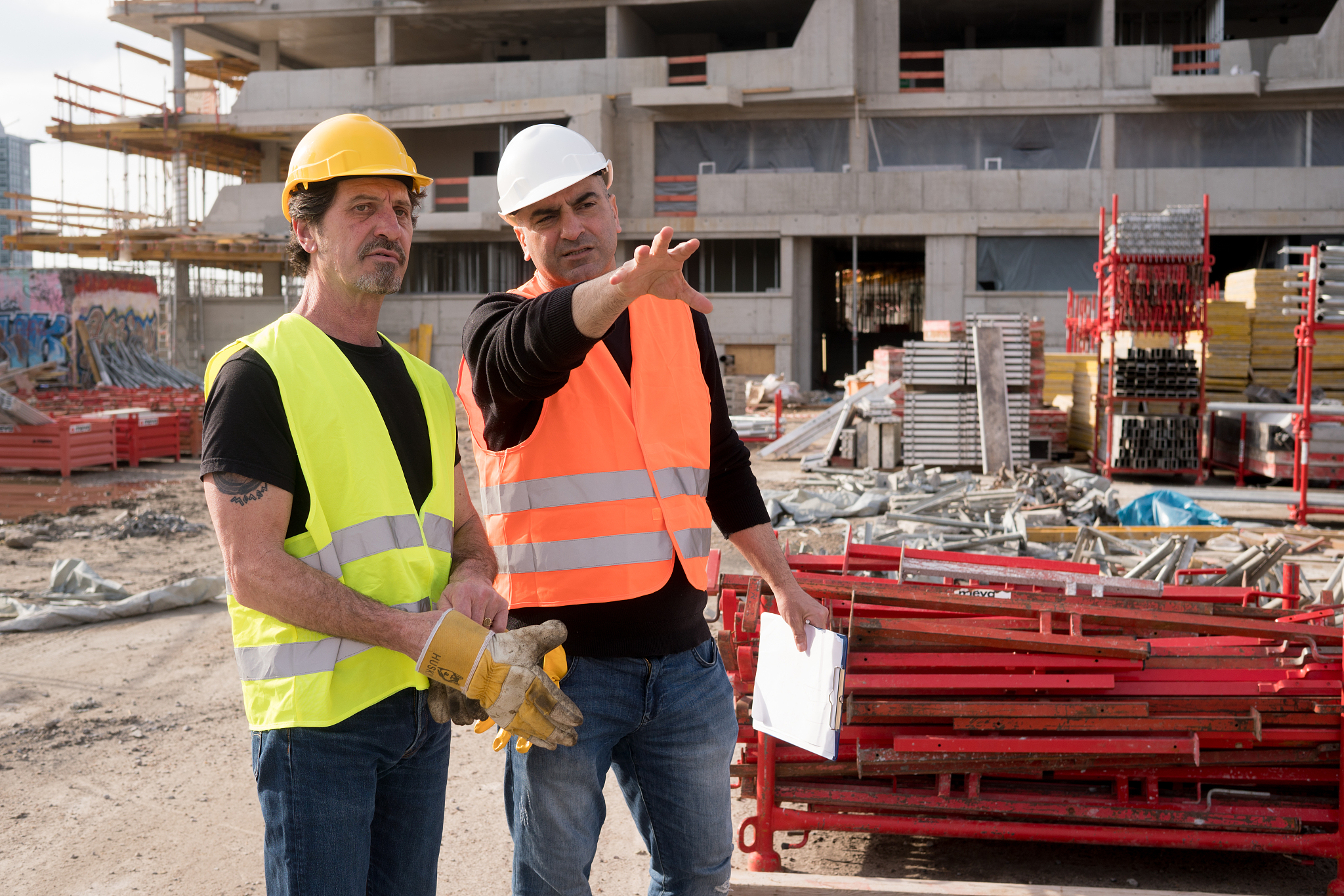 close-up of men working on construction site