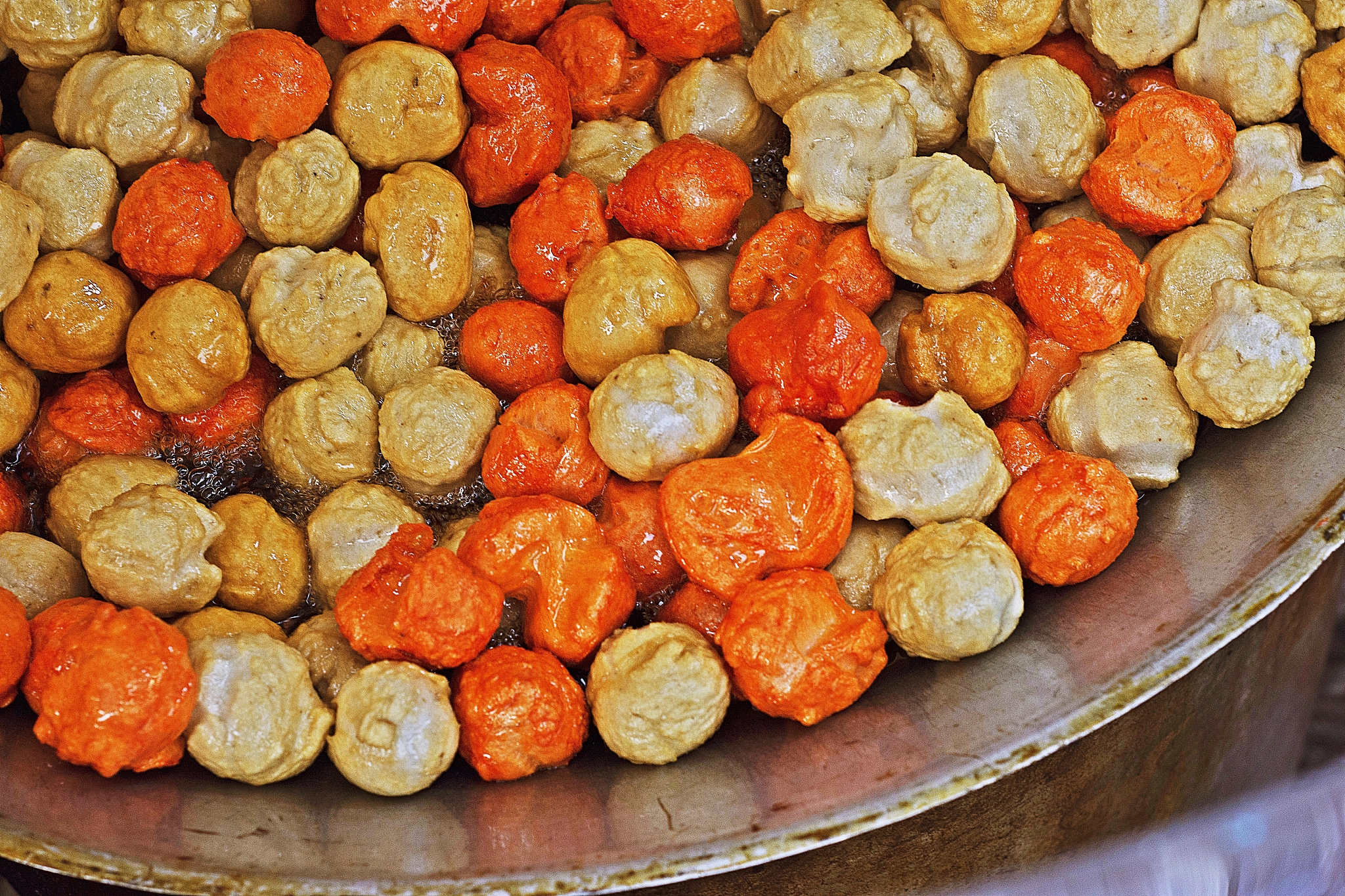 frying meatballs - bangkok street food.