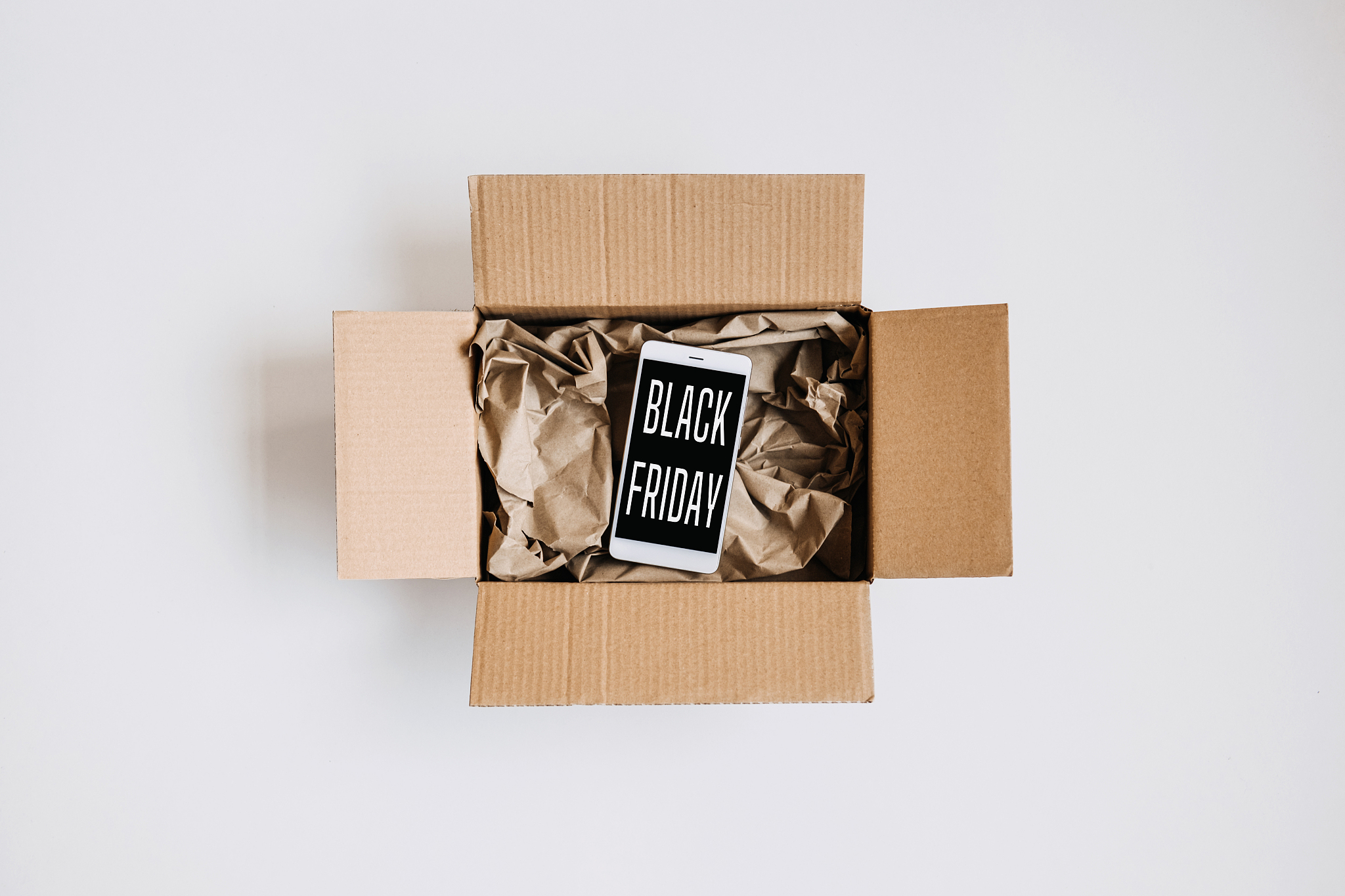 black friday sale, deals concept. packing box, gifts and cell ph