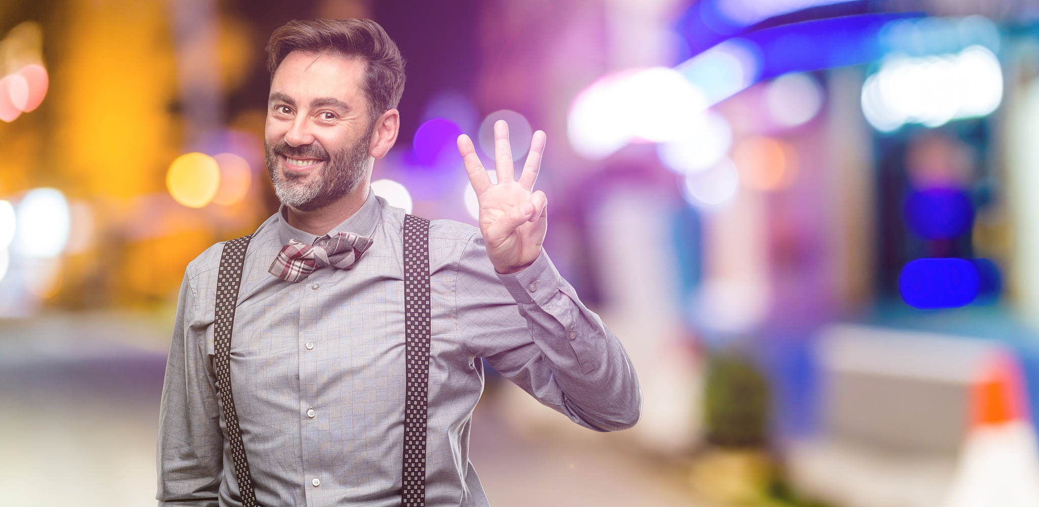 middle age man, with beard and bow tie raising finger, is the nu