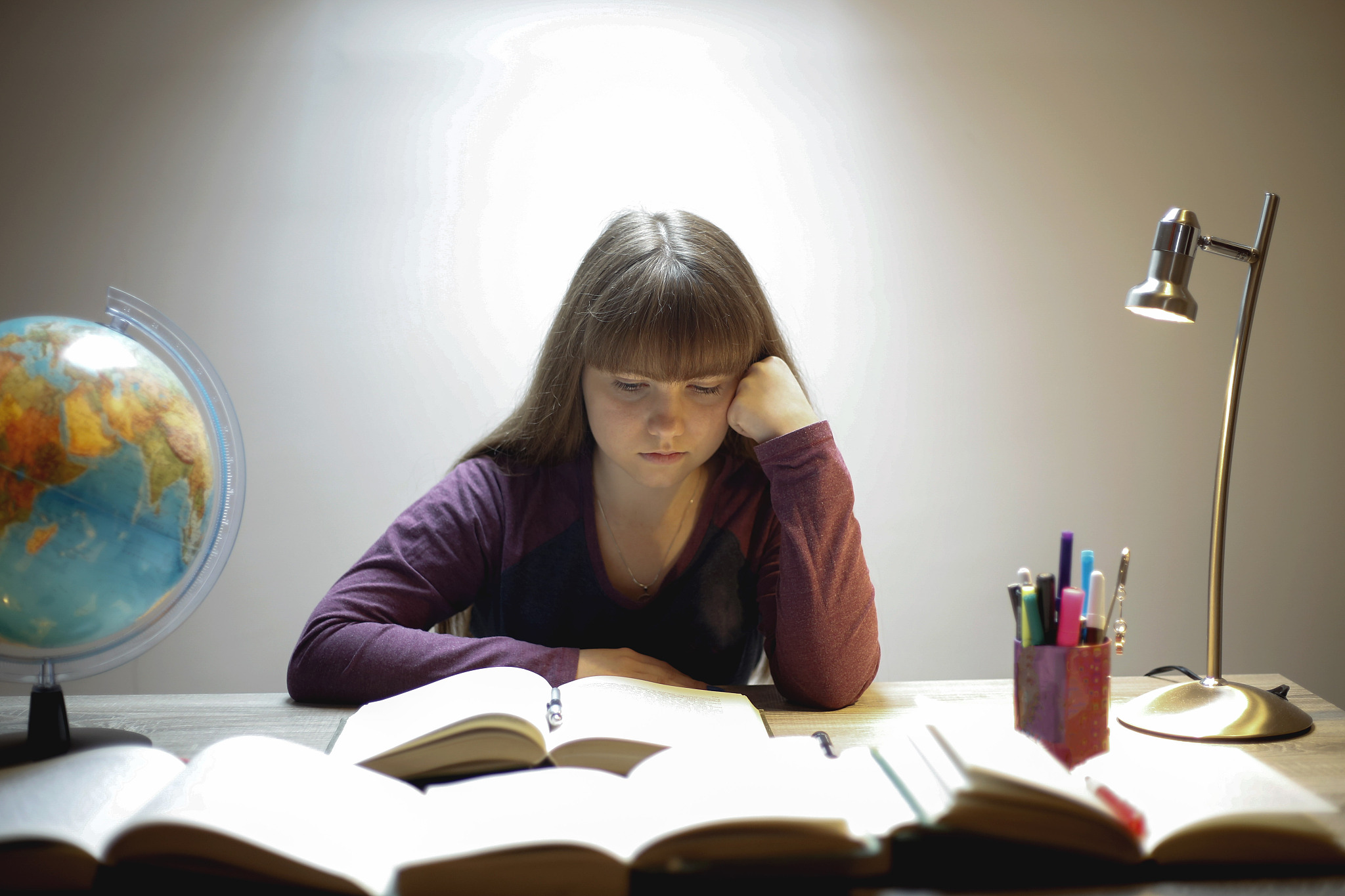 high school student reading a book