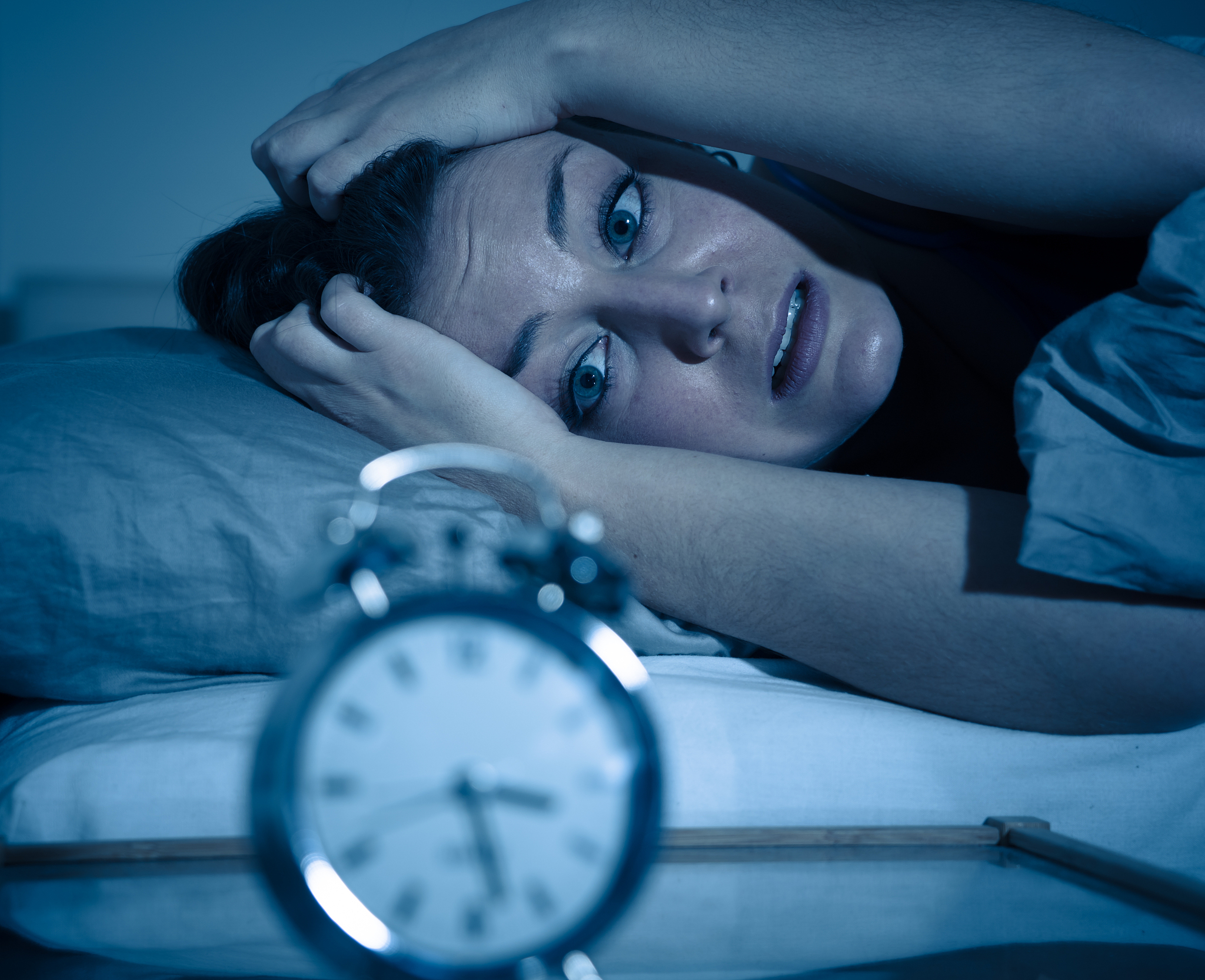 sleepless and desperate beautiful caucasian woman awake at night