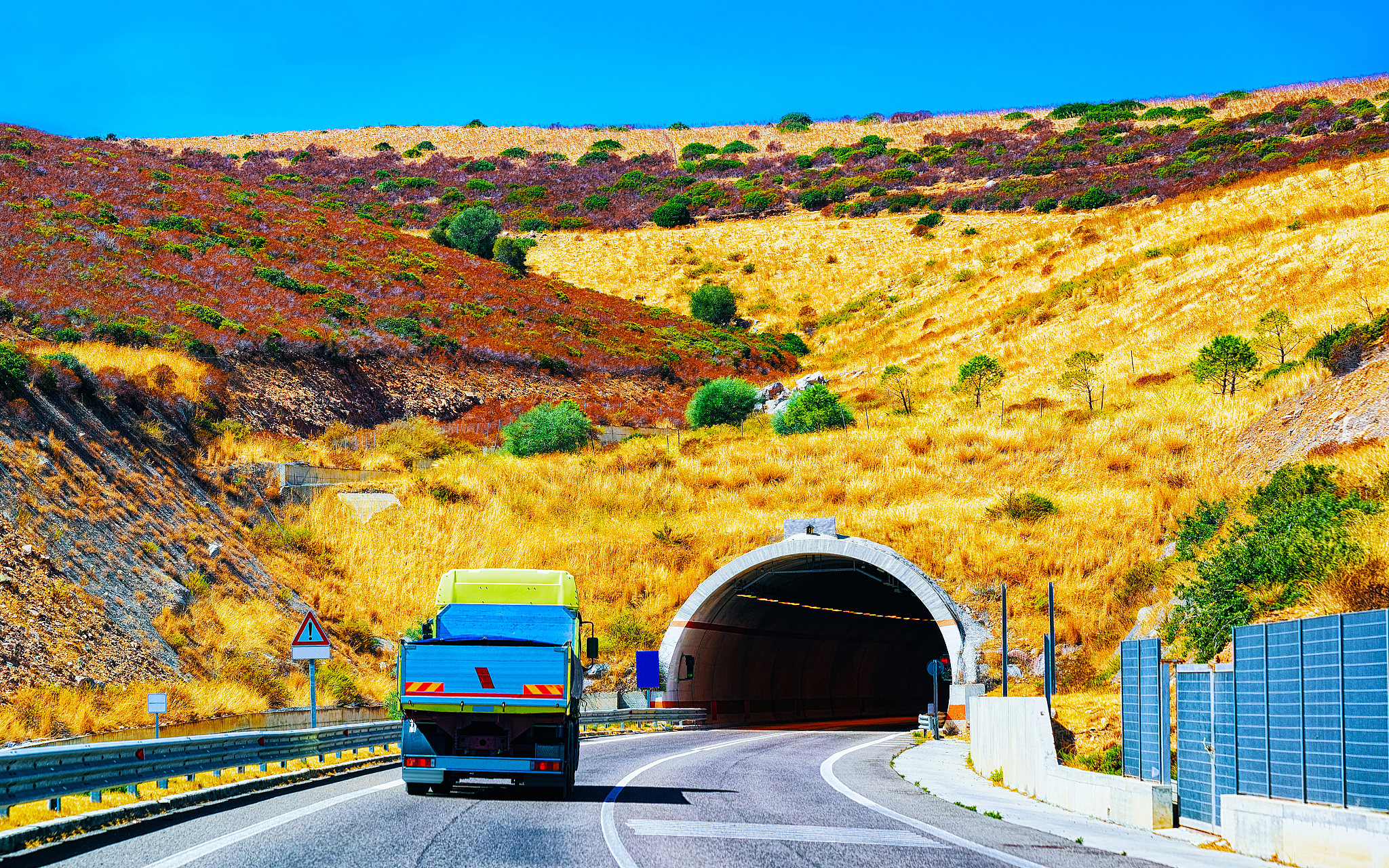truck on road with underpass in cagliari sardinia reflex