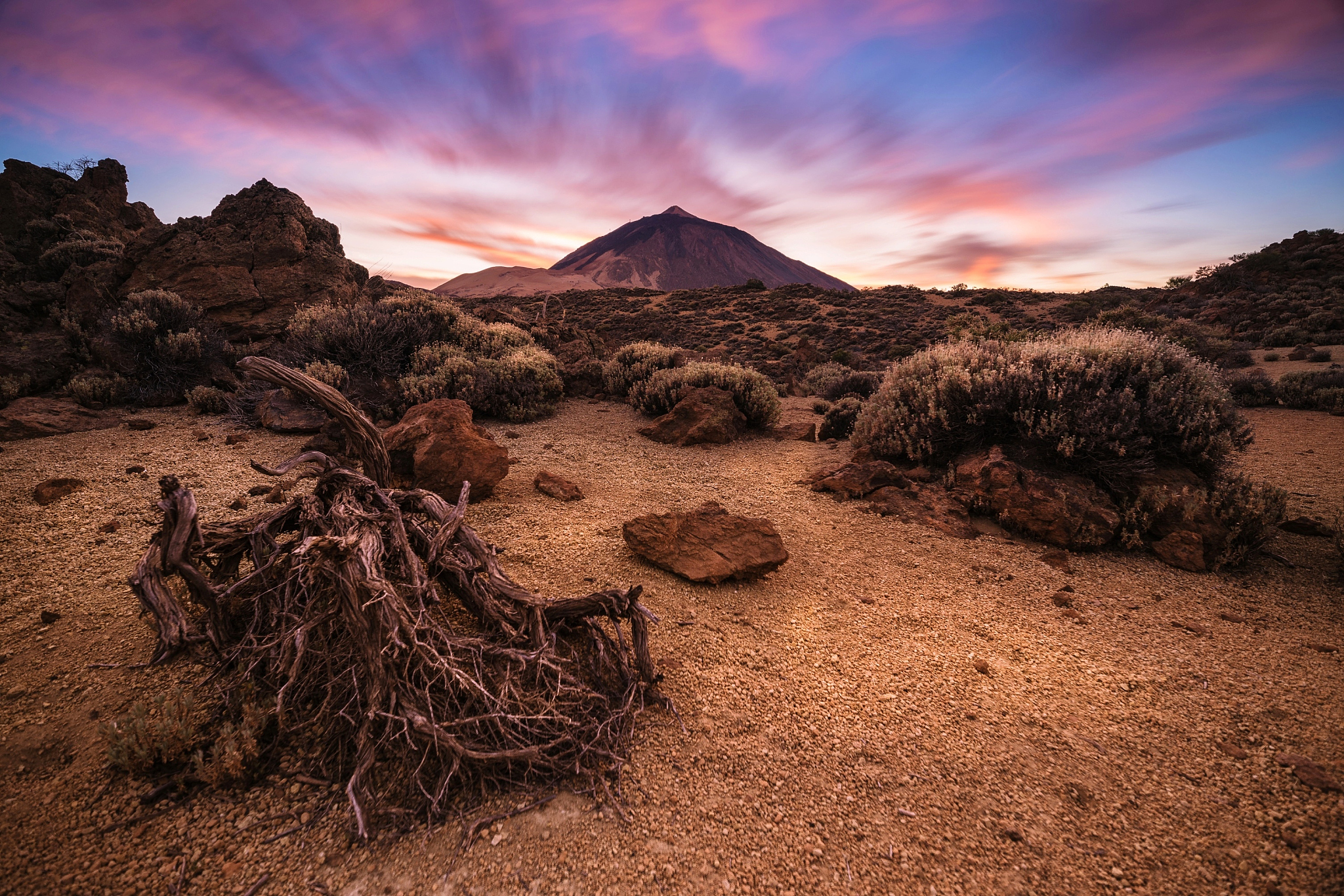 scenic view of desert against sky during sunset