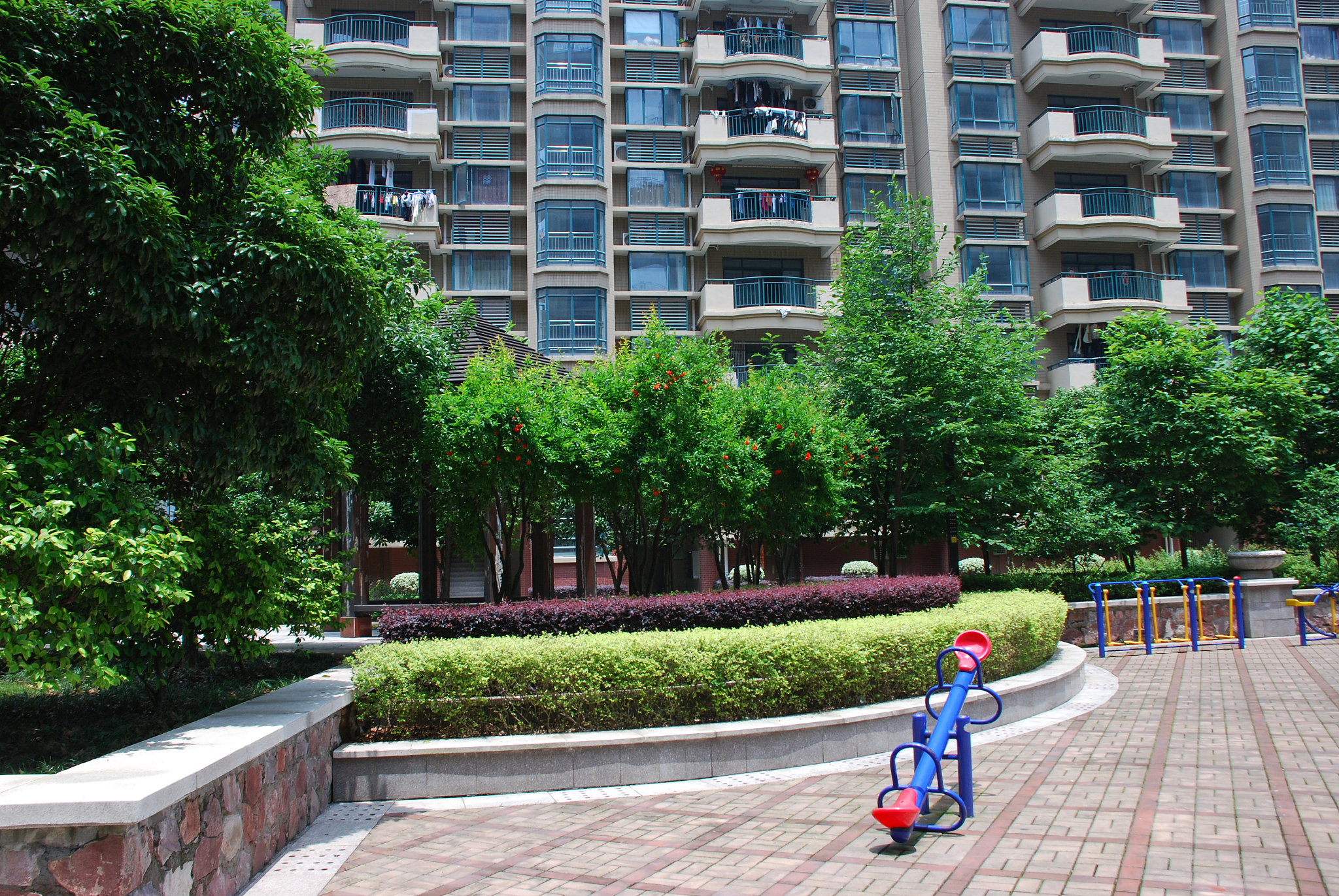 yard with equipment for kids near the building