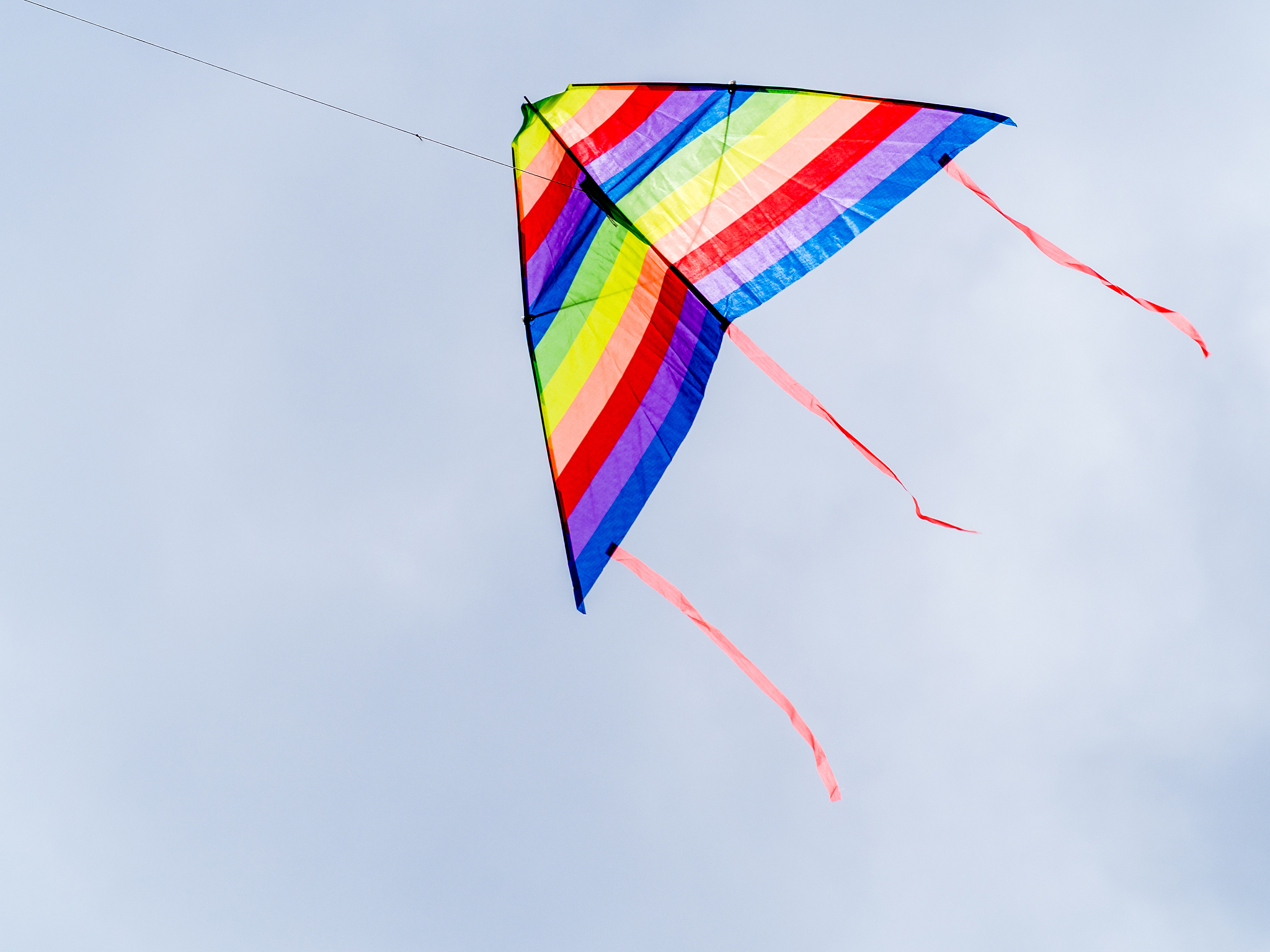 wind kite flying in a blue sky
