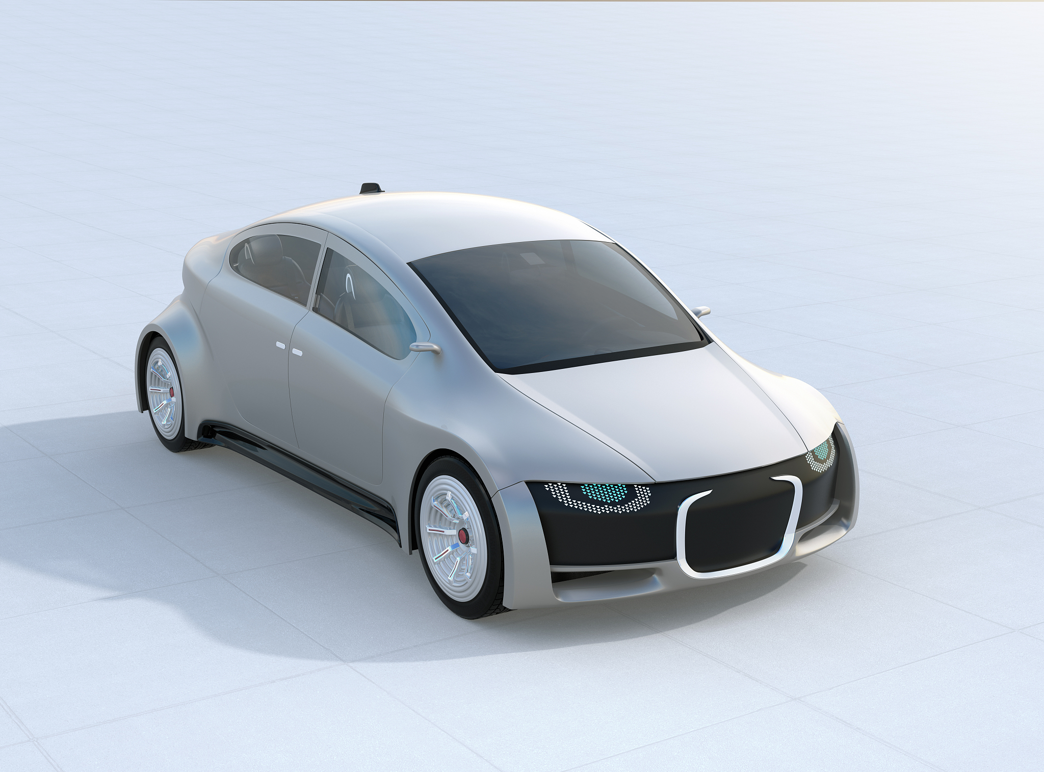 silver self-driving car parking on the ground