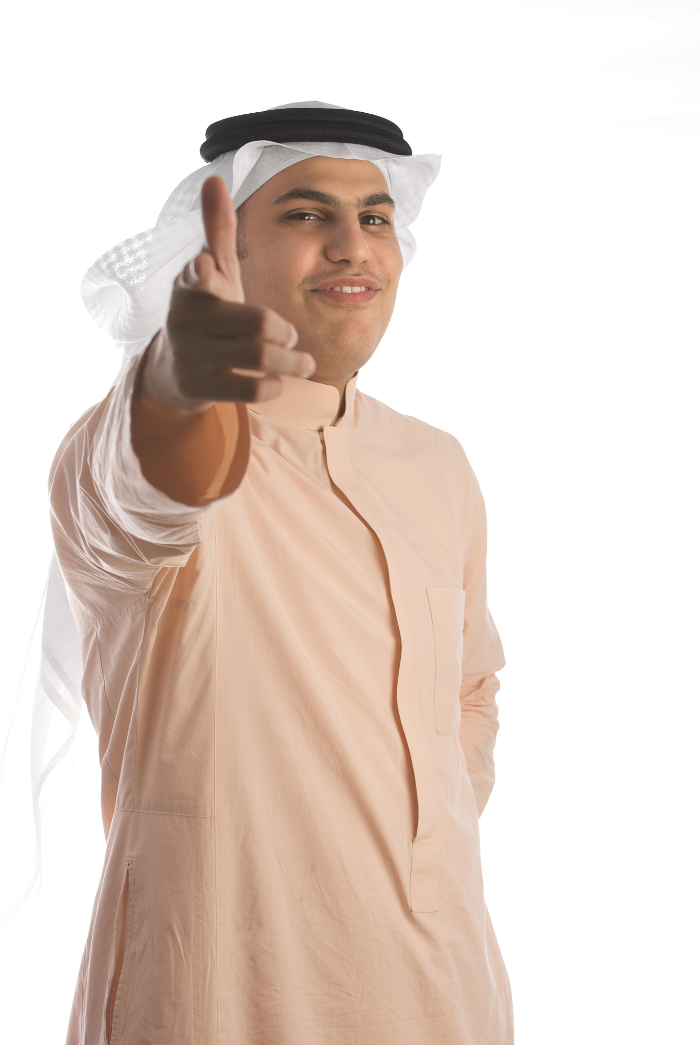 saudi arabian businessman wearing thobe and smiling