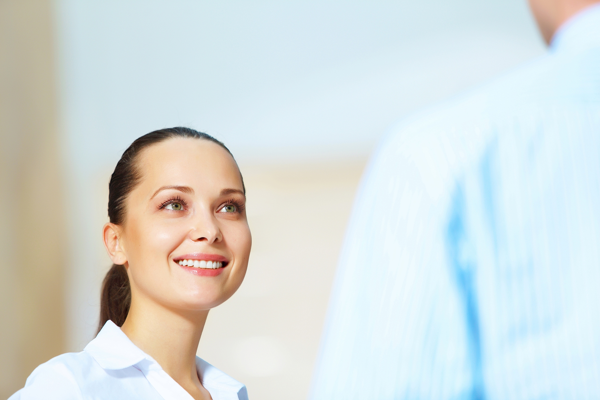 portrait of happy smiling young businesswoman in office
