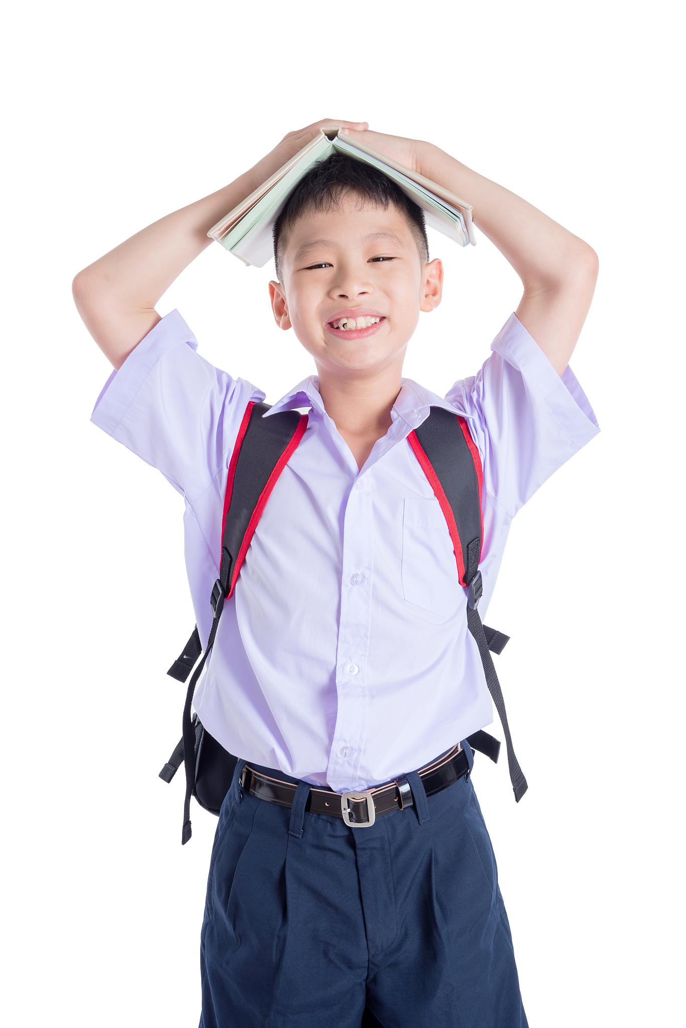 young student in uniform smiling over white