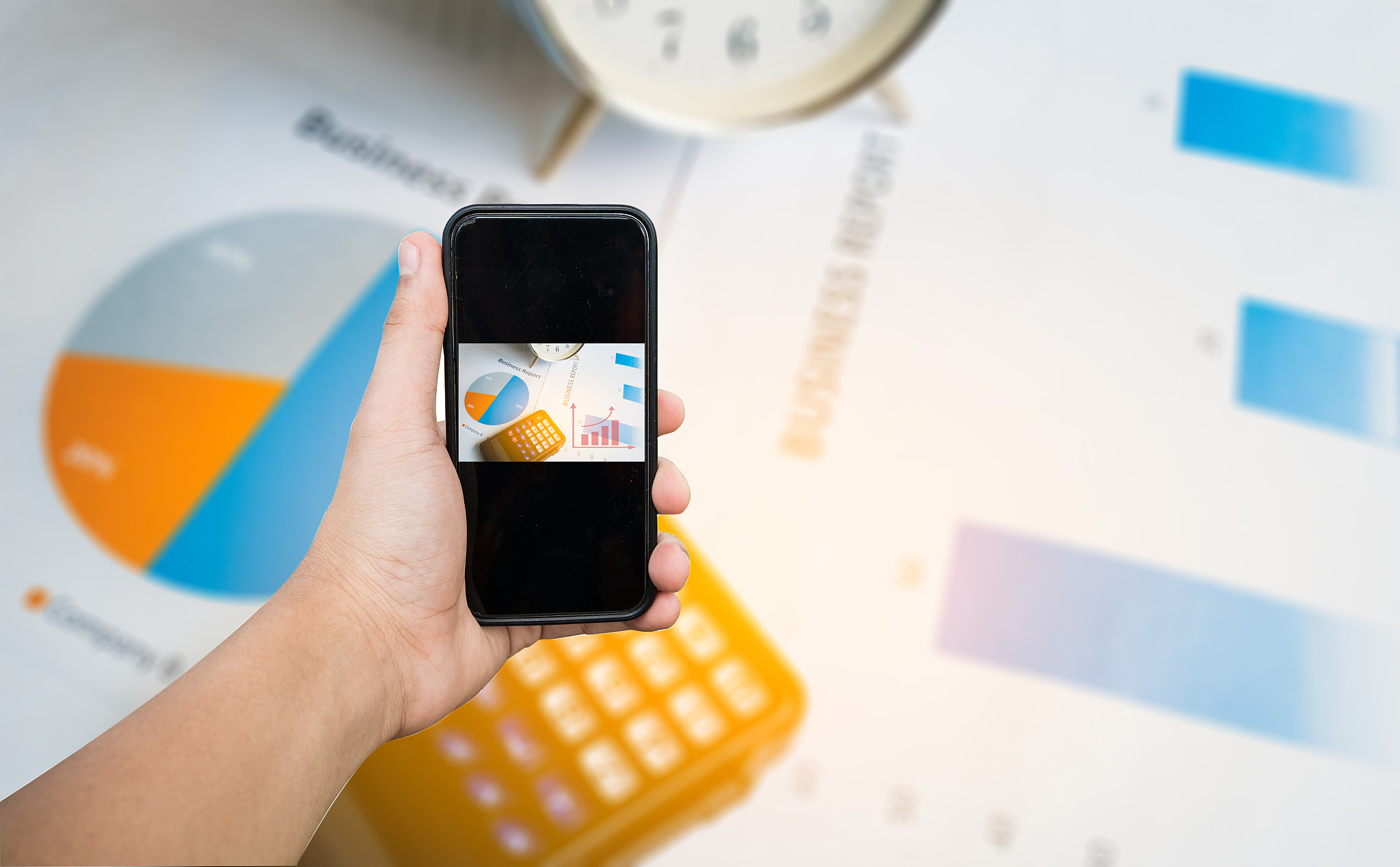 smart phone on business report or financial paper