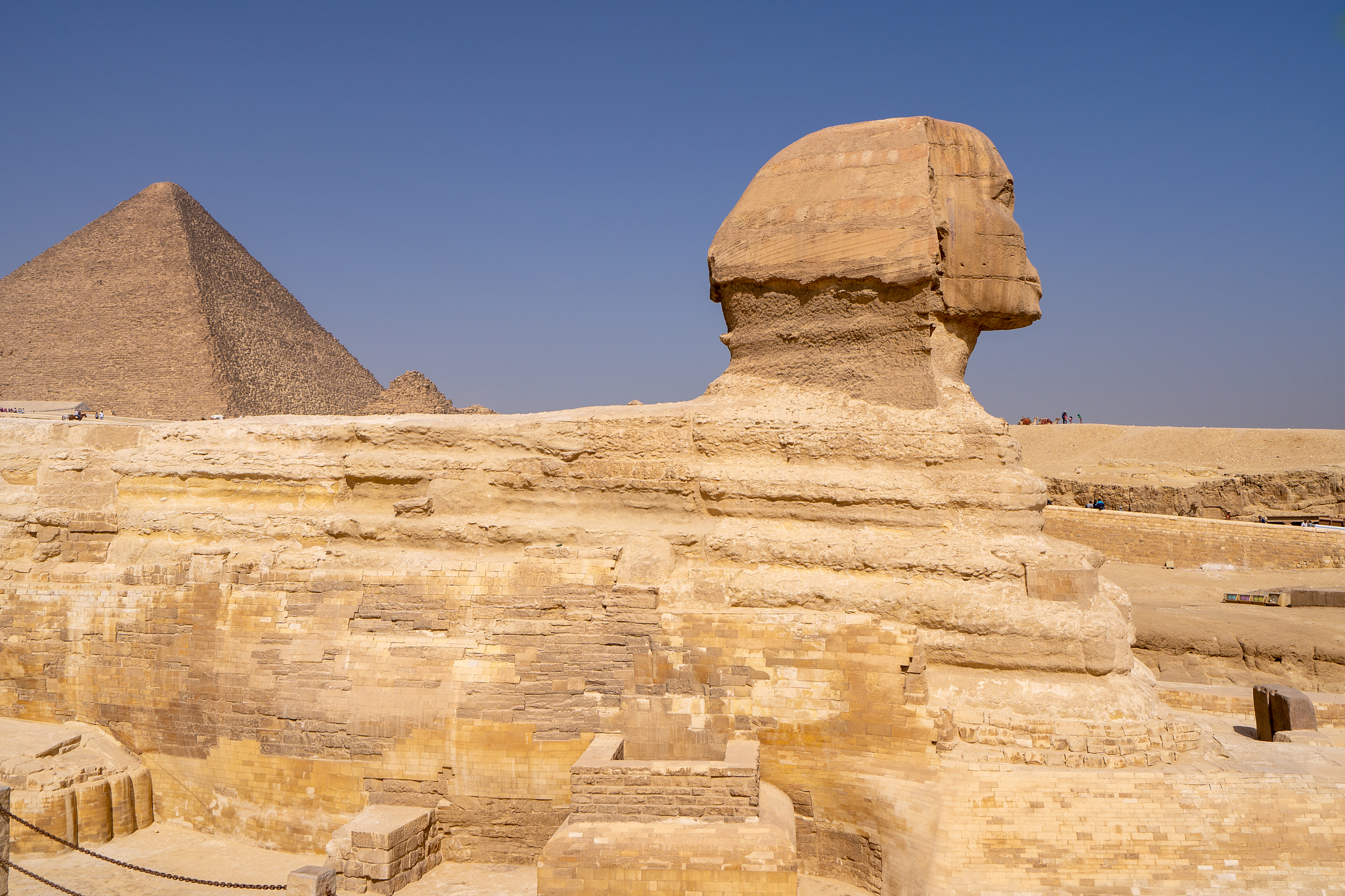 great sphinx of giza, with the great pyramid in the background
