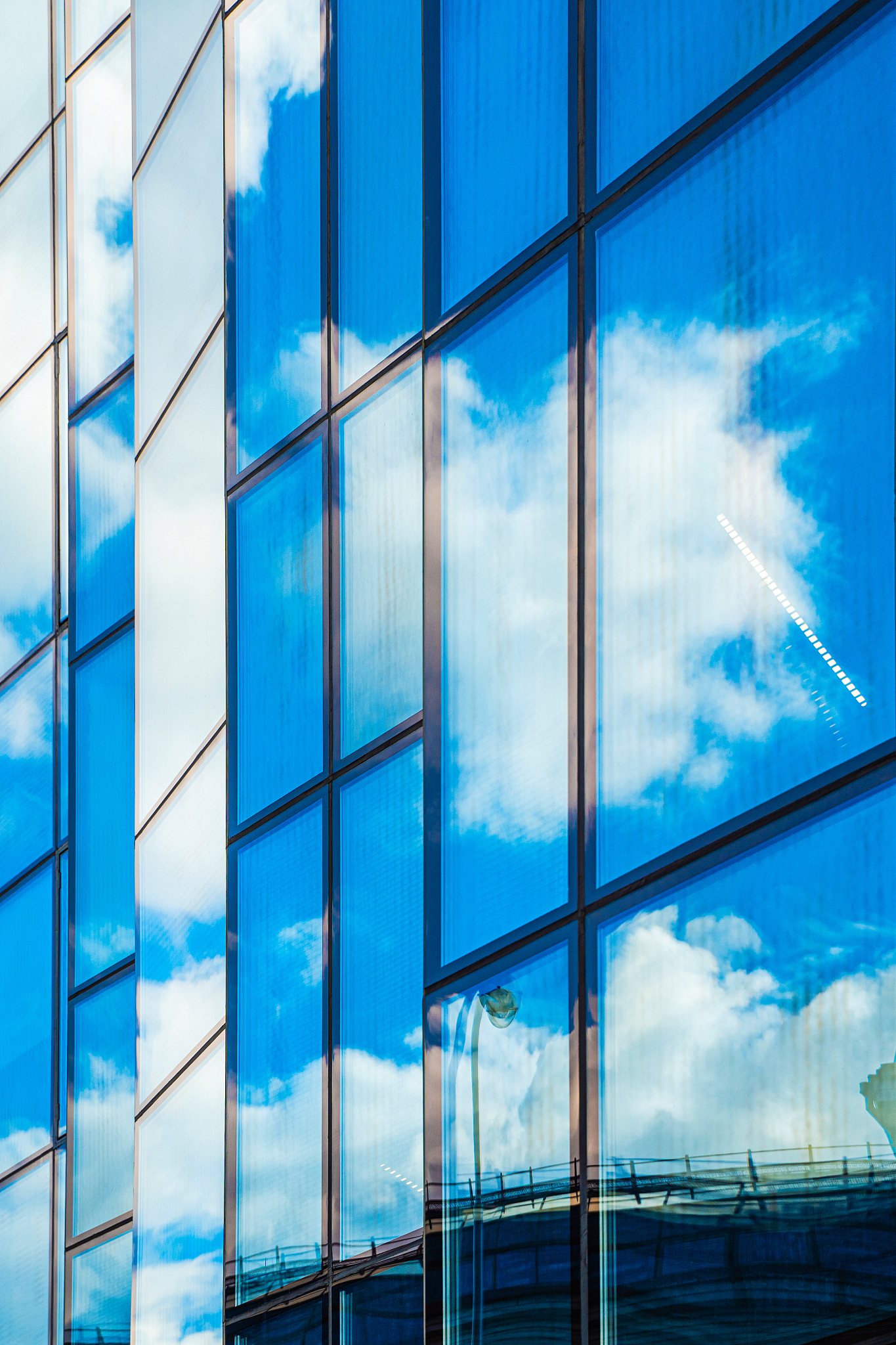 reflections of the sky in the glass facade