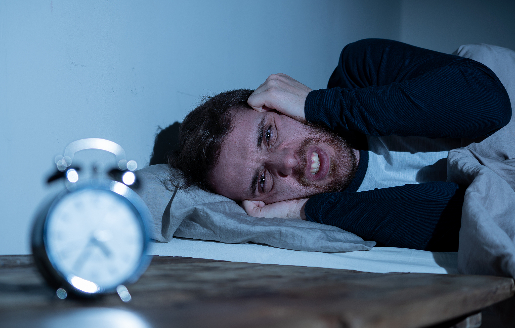 sleepless and desperate young caucasian man awake at night not a
