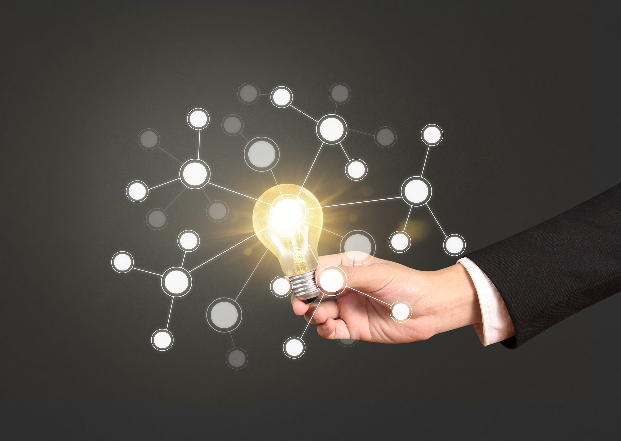 holding lightbulb in  hand