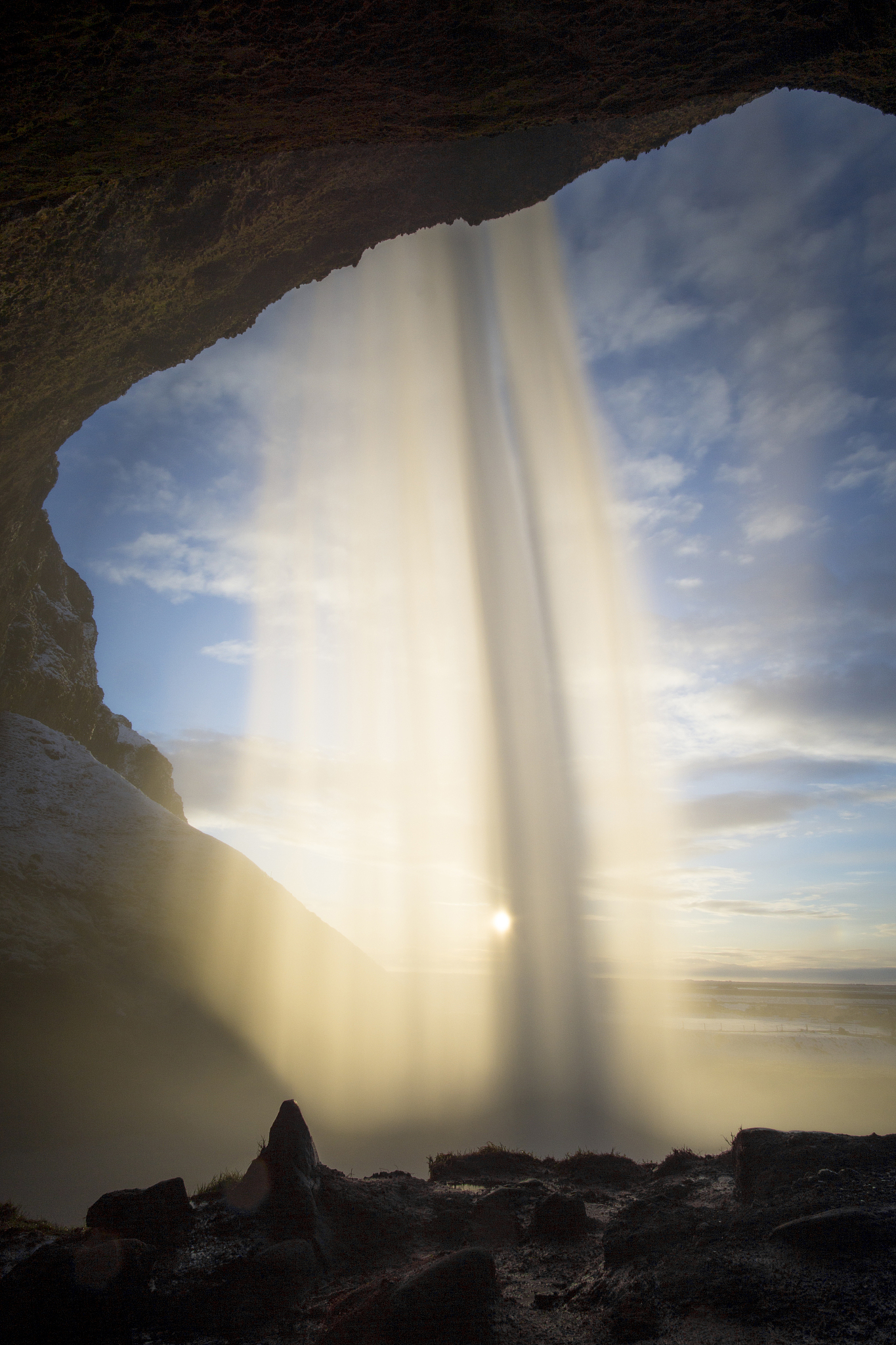 seljalandsfoss waterfall against the sun, iceland