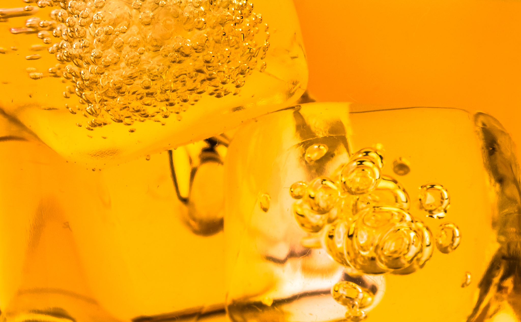 close-up of whiskey in glass with ice used for background
