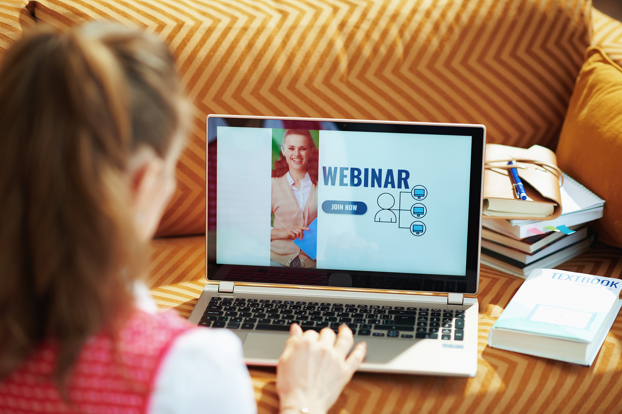 woman in house in sunny day going to watch webinar