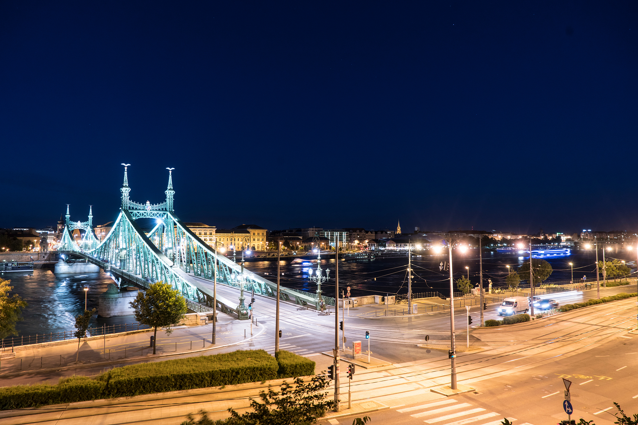 high angle view of illuminated city buildings against clear blue
