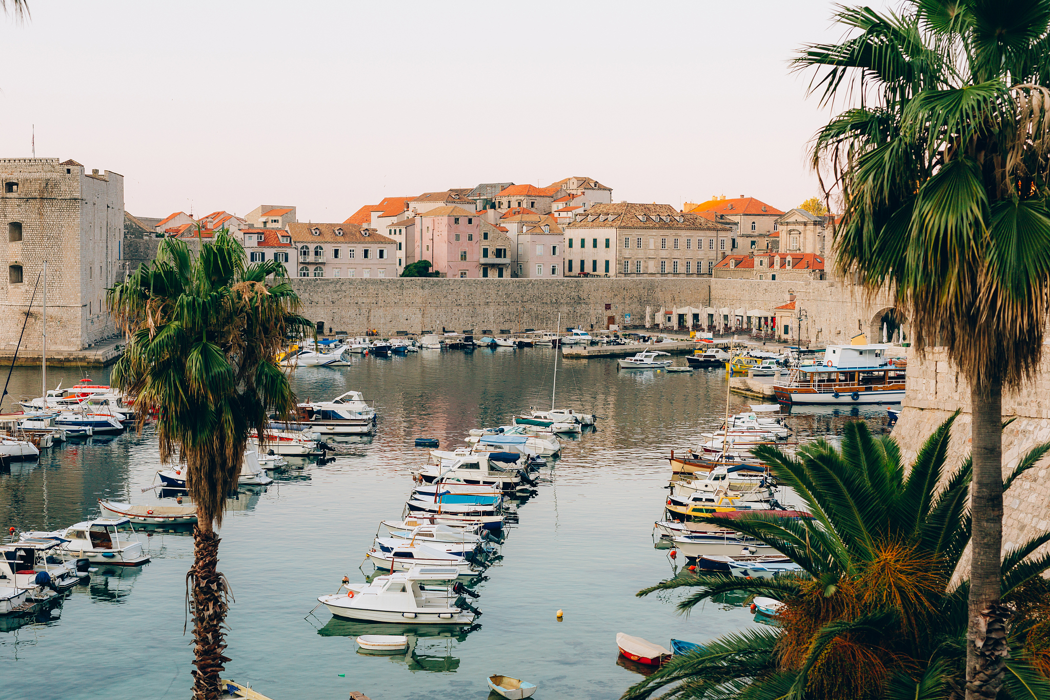 the boat dock near the old city of dubrovnik, croatia. the harbo