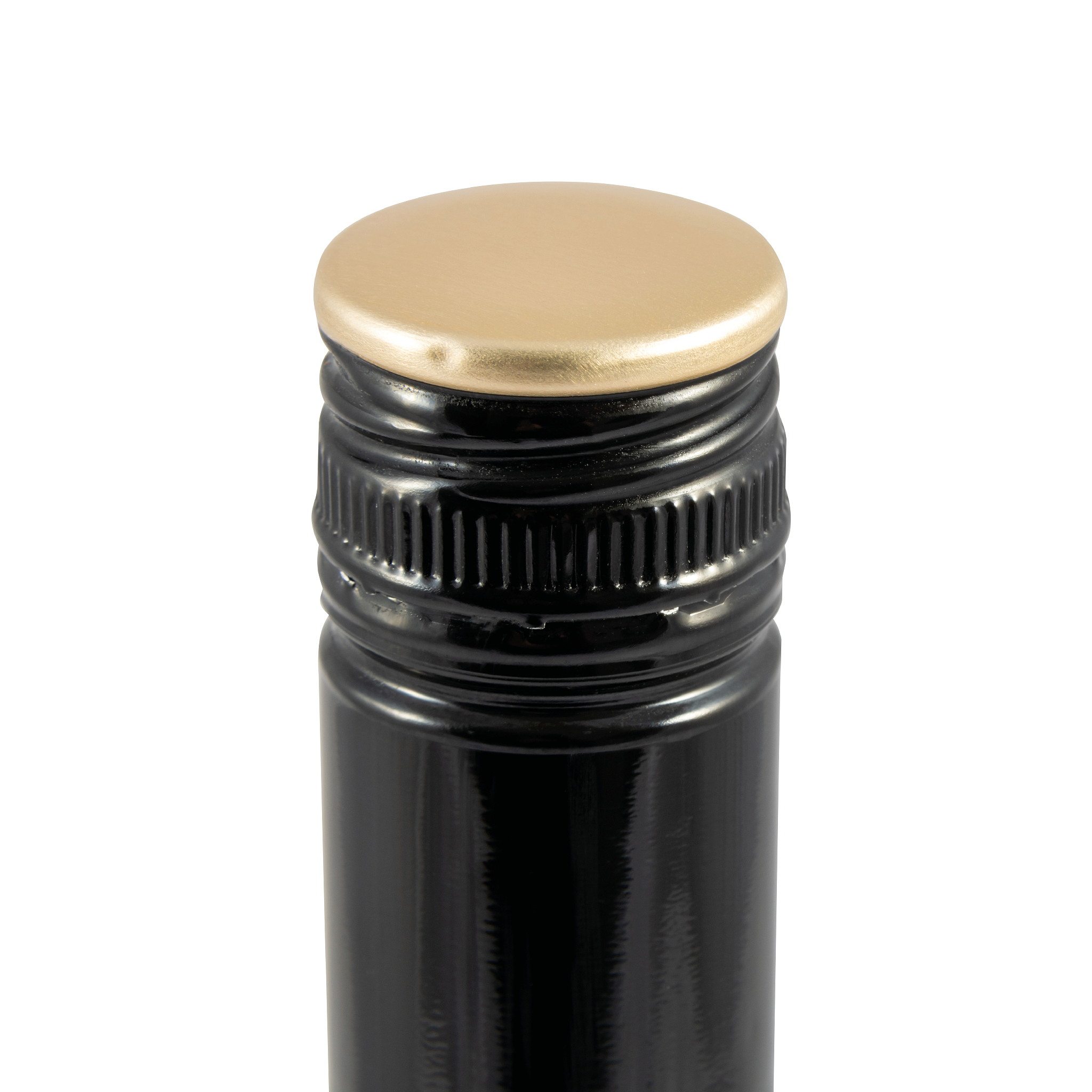 close up detail of black and gold lid on a bottle