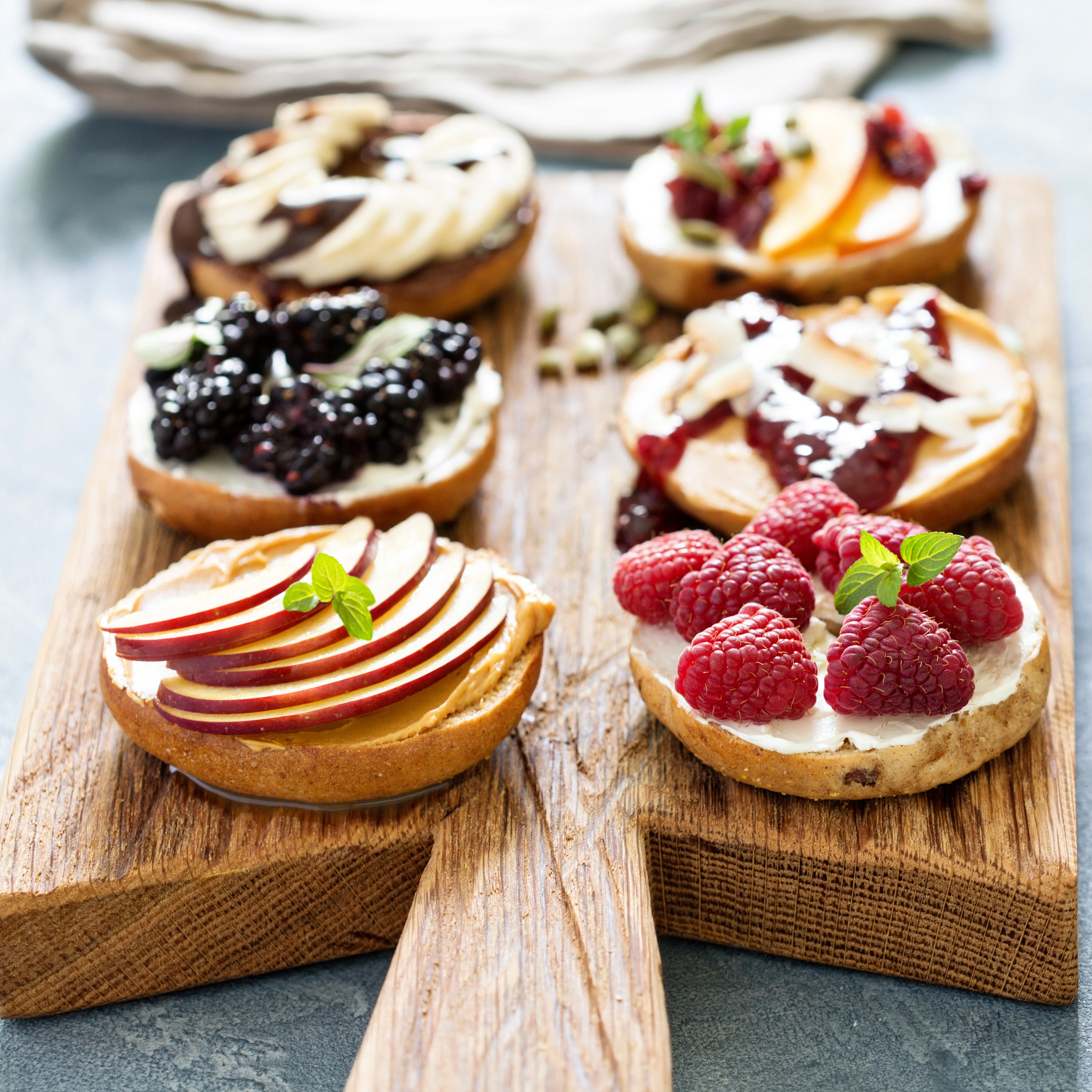 variety of bagels on a board