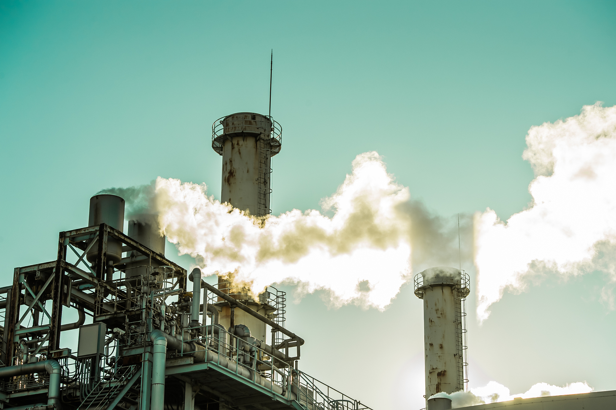 a model of a chimney in an industrial area. with a beautiful sky
