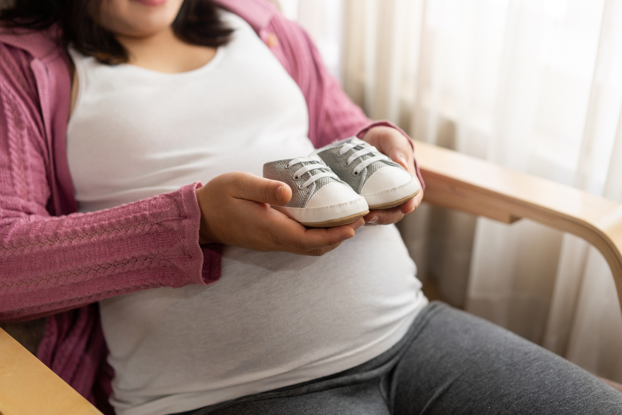 happy pregnant woman and expecting baby at home.