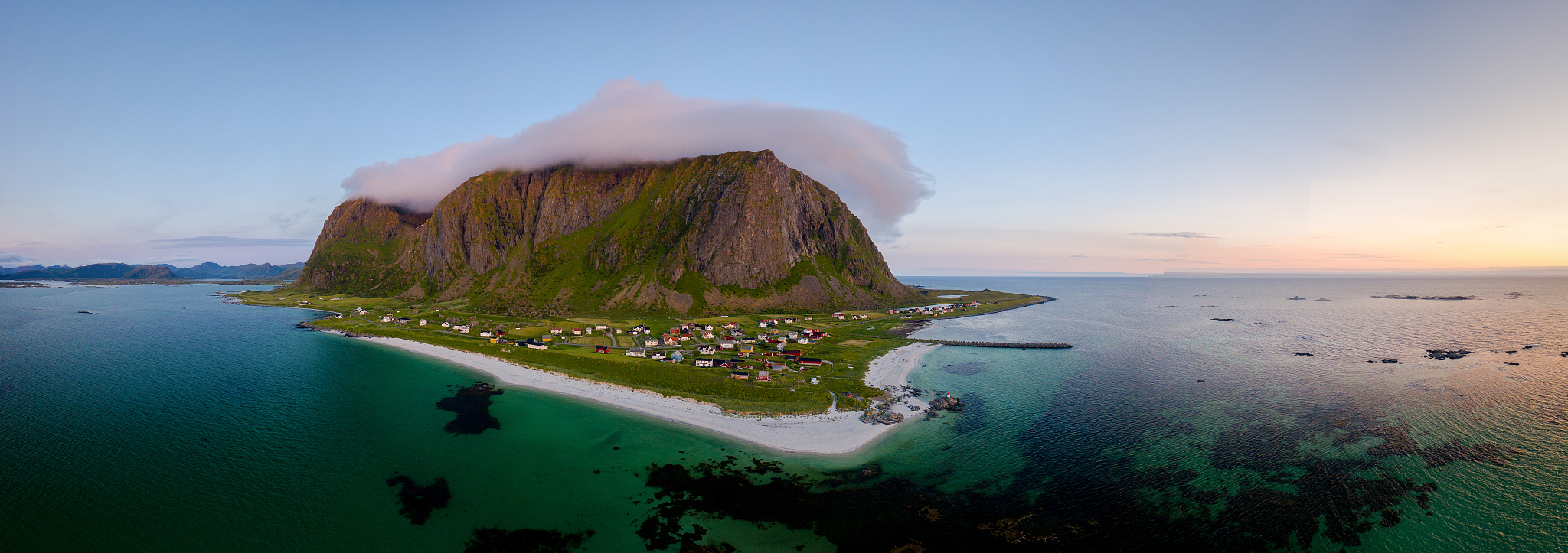 aerial view of a mountain overlooking a village in bstad, norway