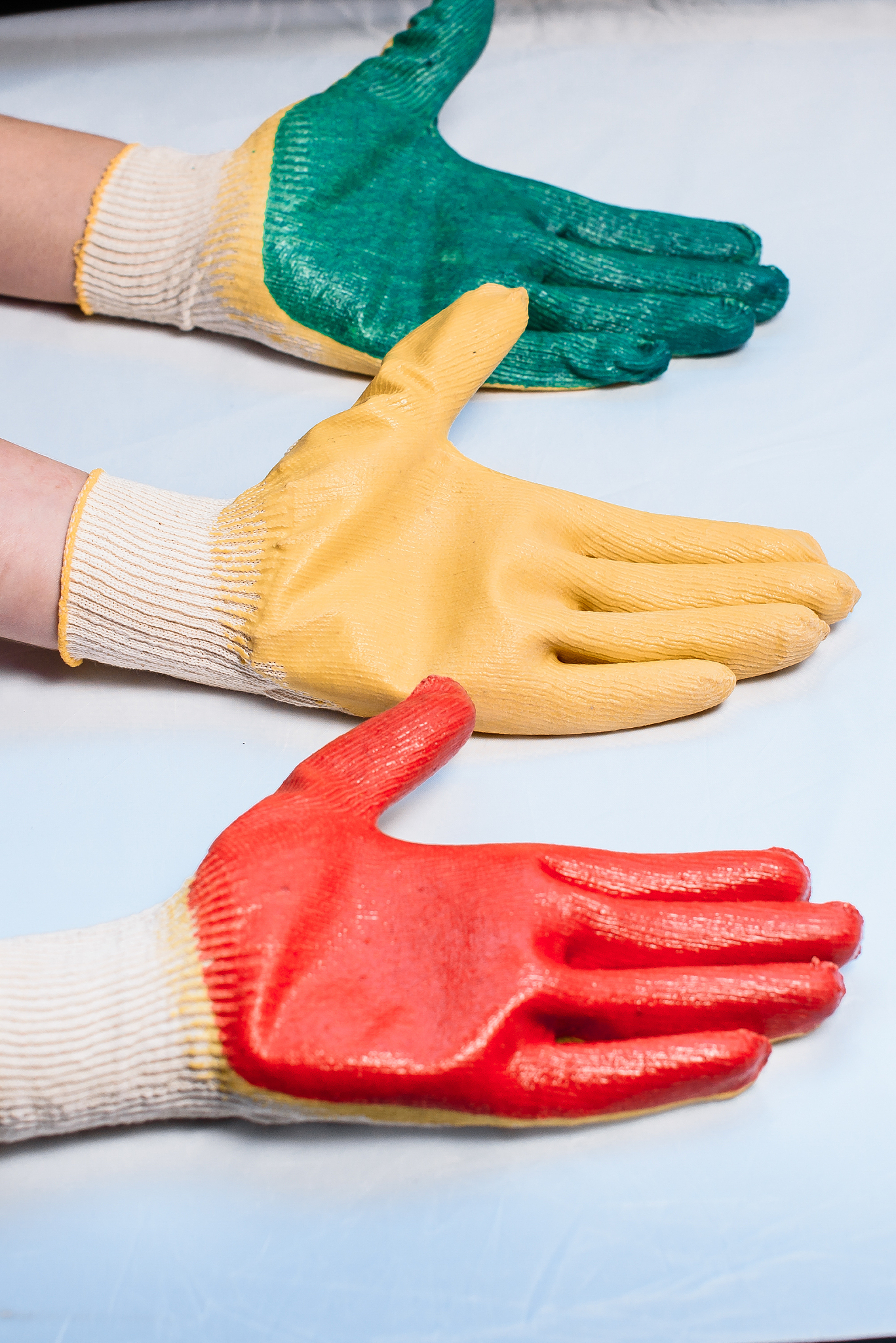 worker wearing leather work glove giving the thumbs up sign whit
