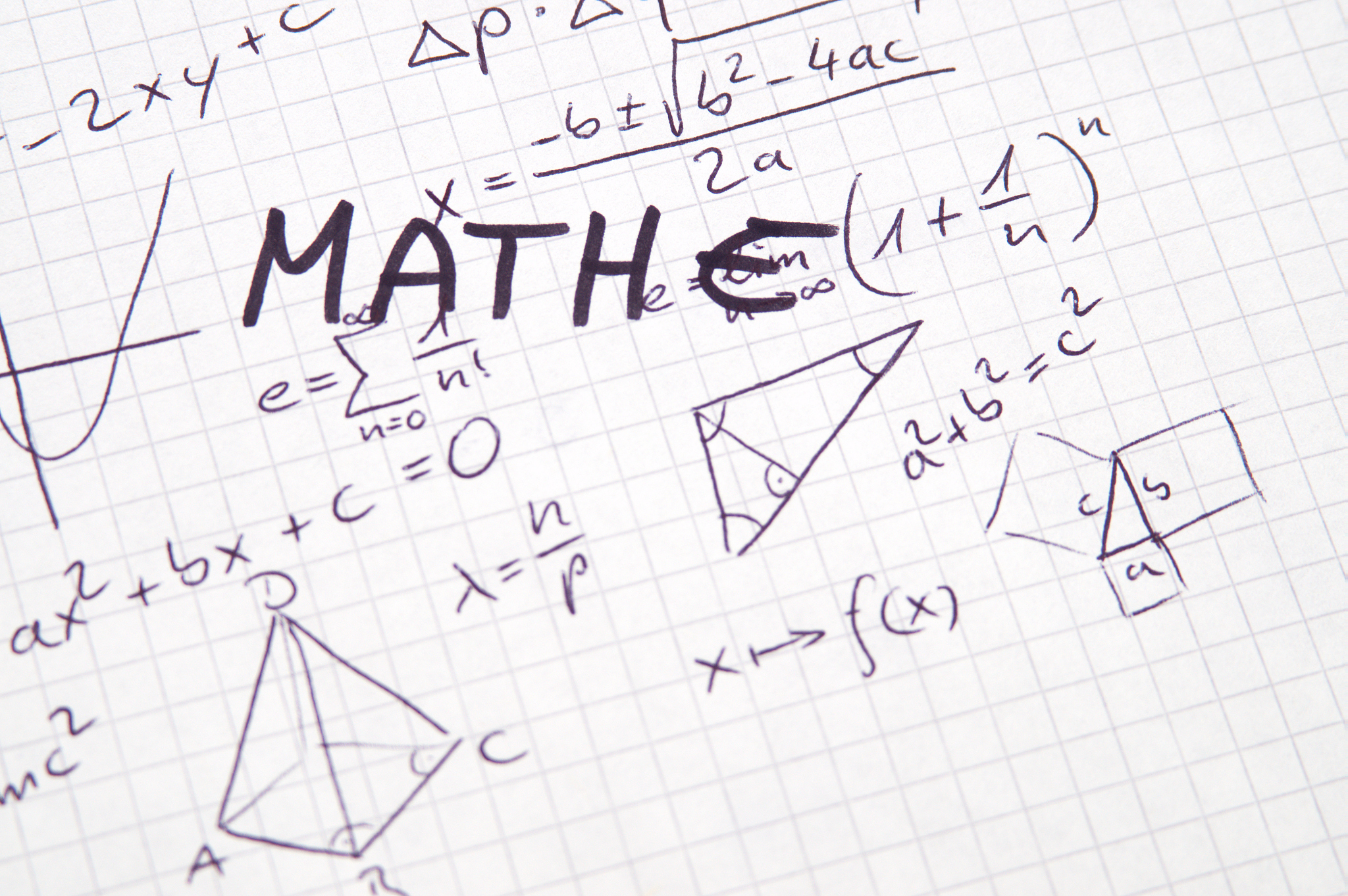word mathe (german for math) in handwriting on checkered paper w