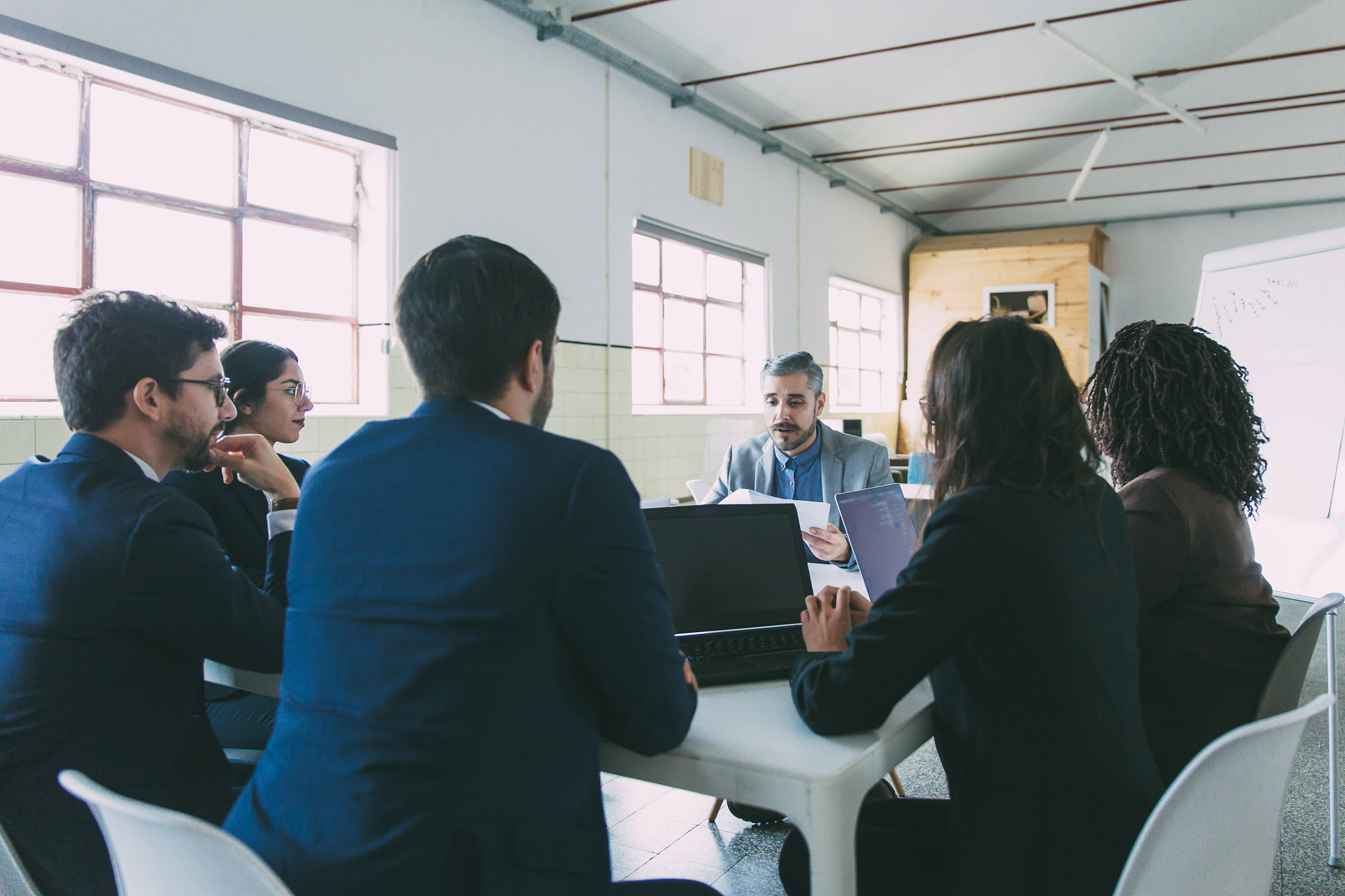 group of confident managers during morning briefing