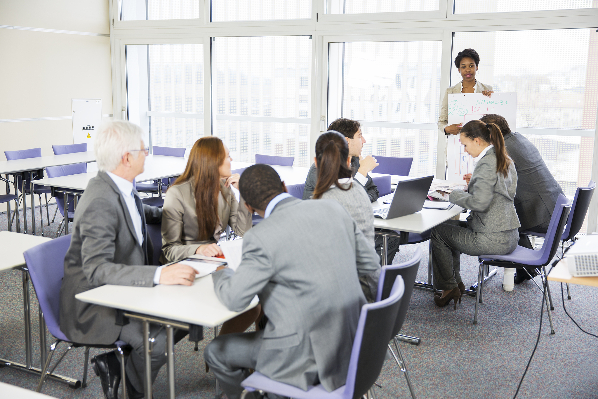 business people in education room listening lecture of black tea