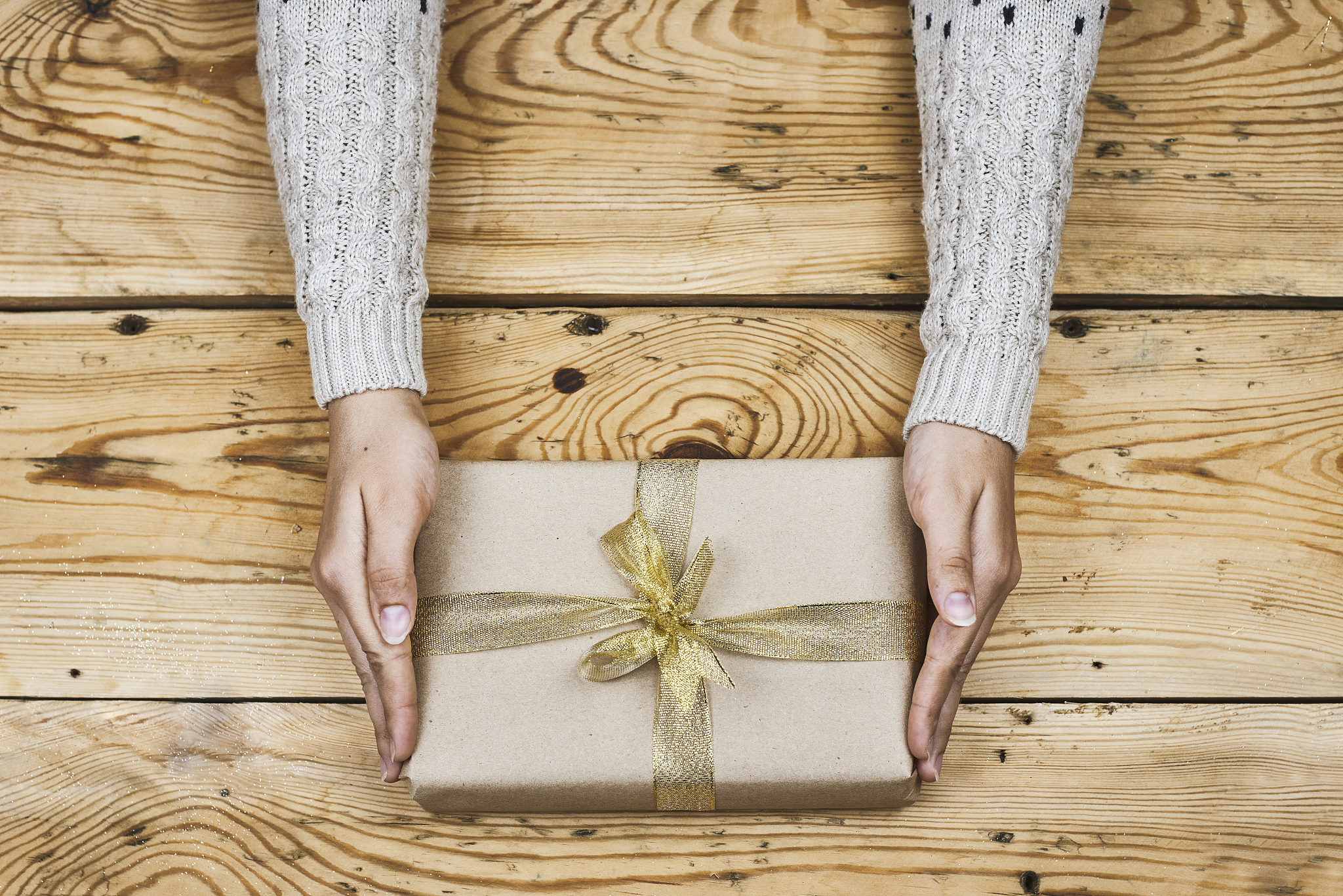 woman holding a christmas present