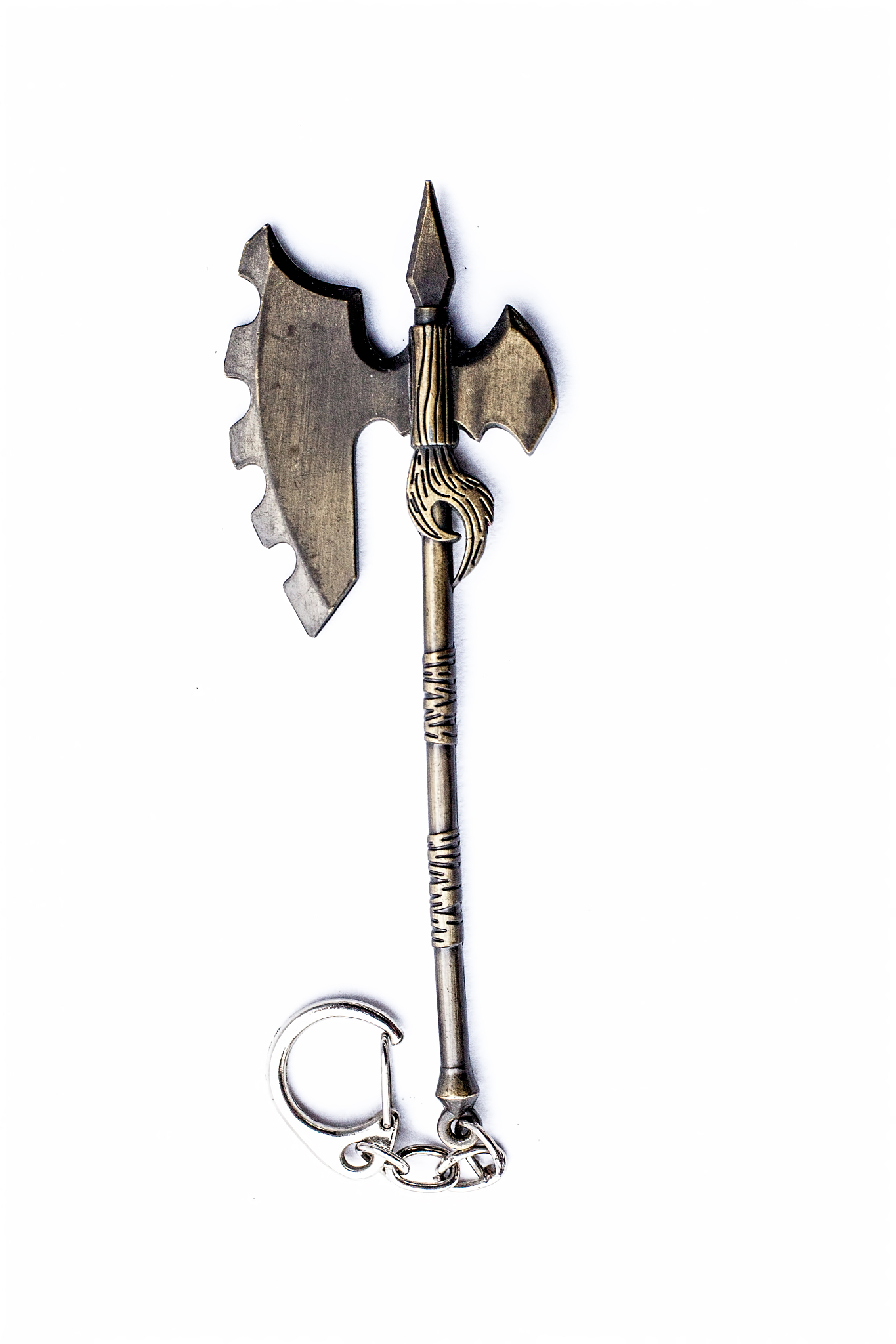 close up of axe key chain of golden color isolated on white.