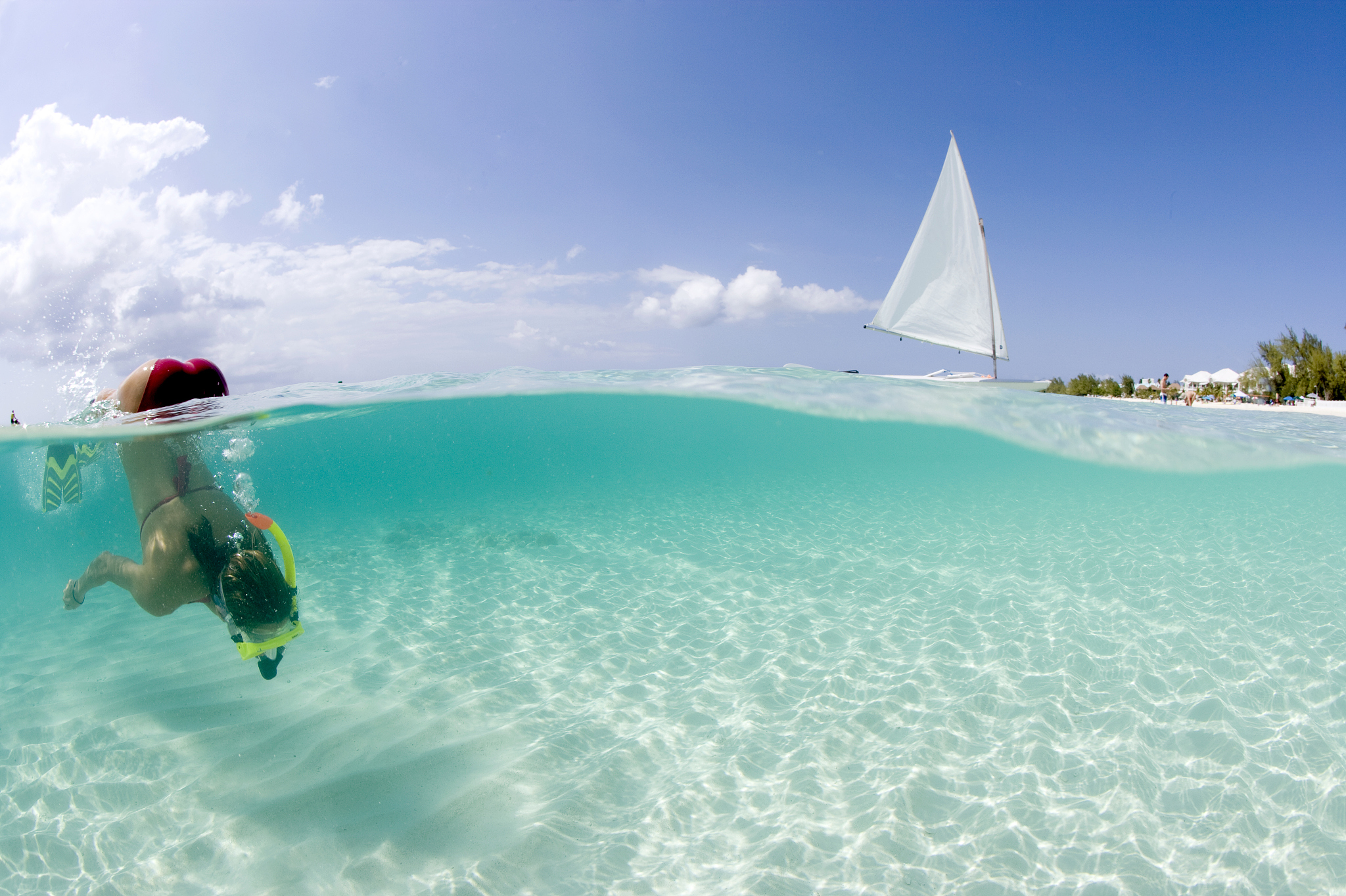snorkeler at seven mile beach, grand cayman