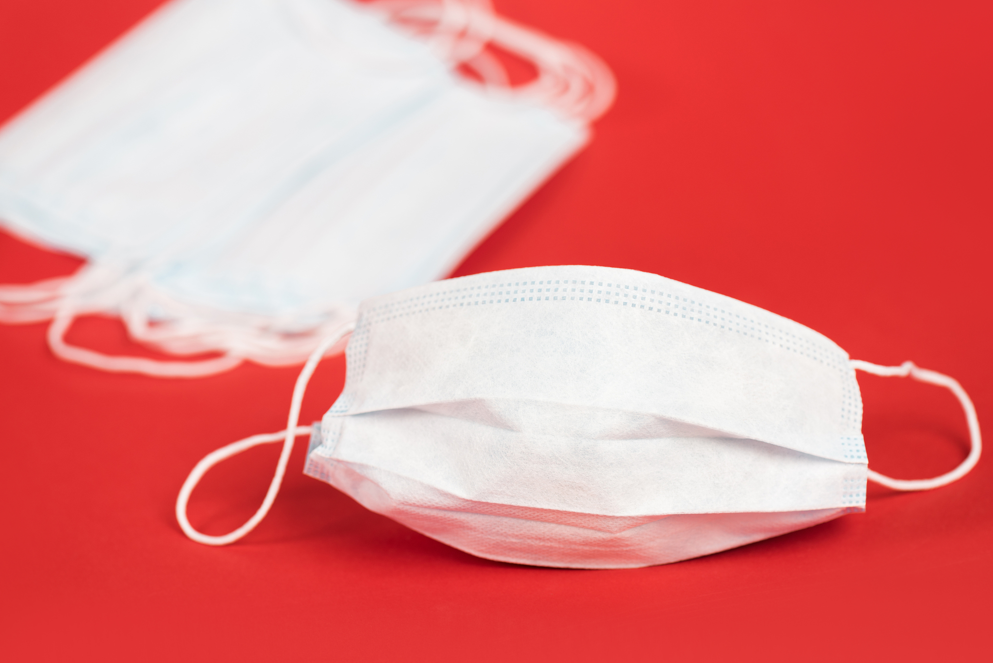 selective focus of protective medical masks on red