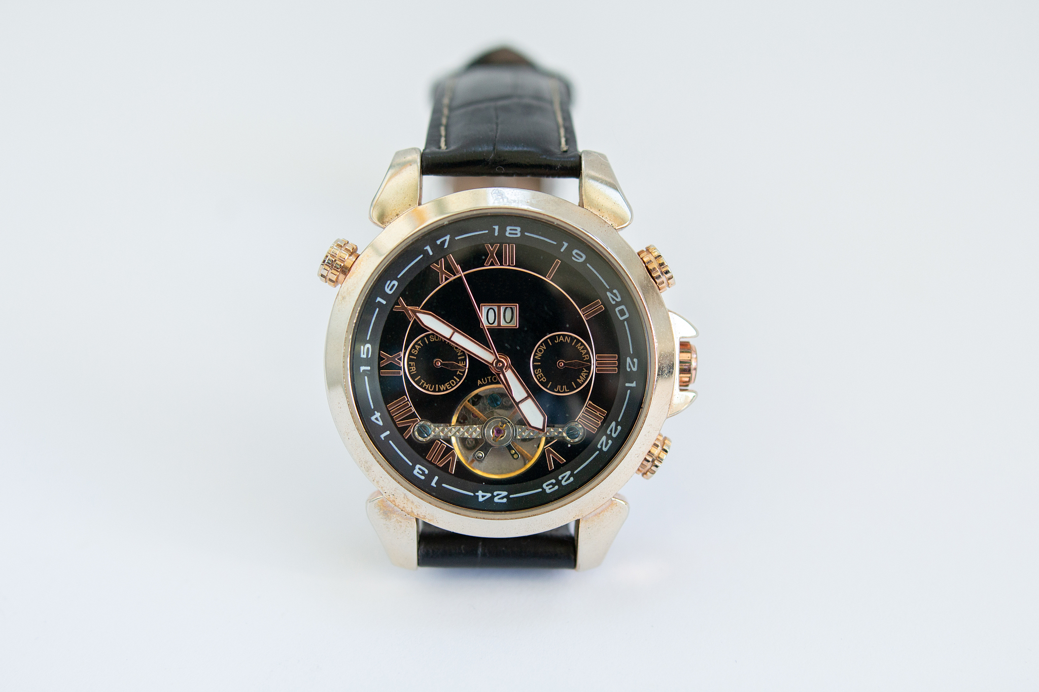 men's gold watch with a leather strap