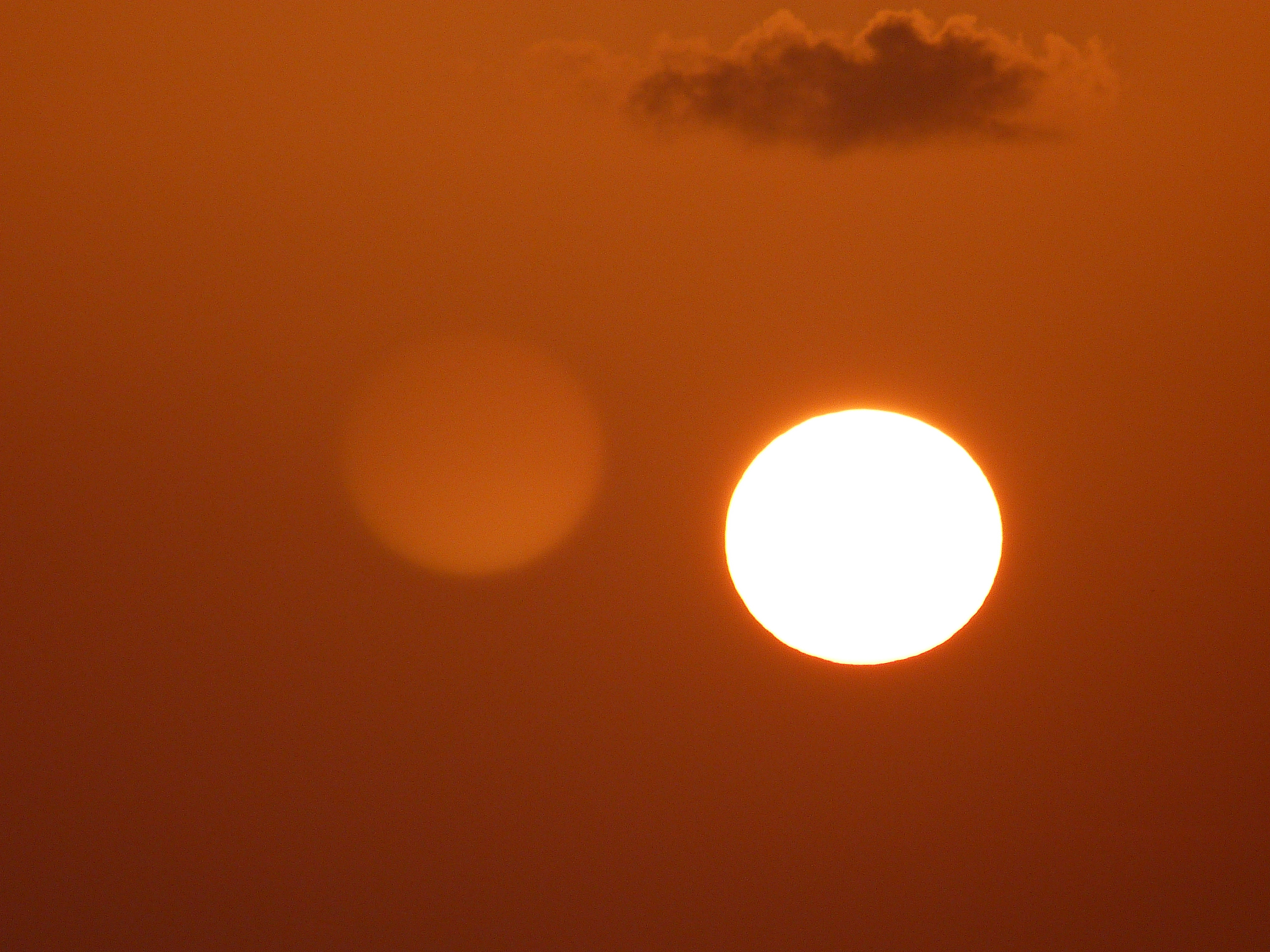 two suns and cloud above the sea, island of martinique