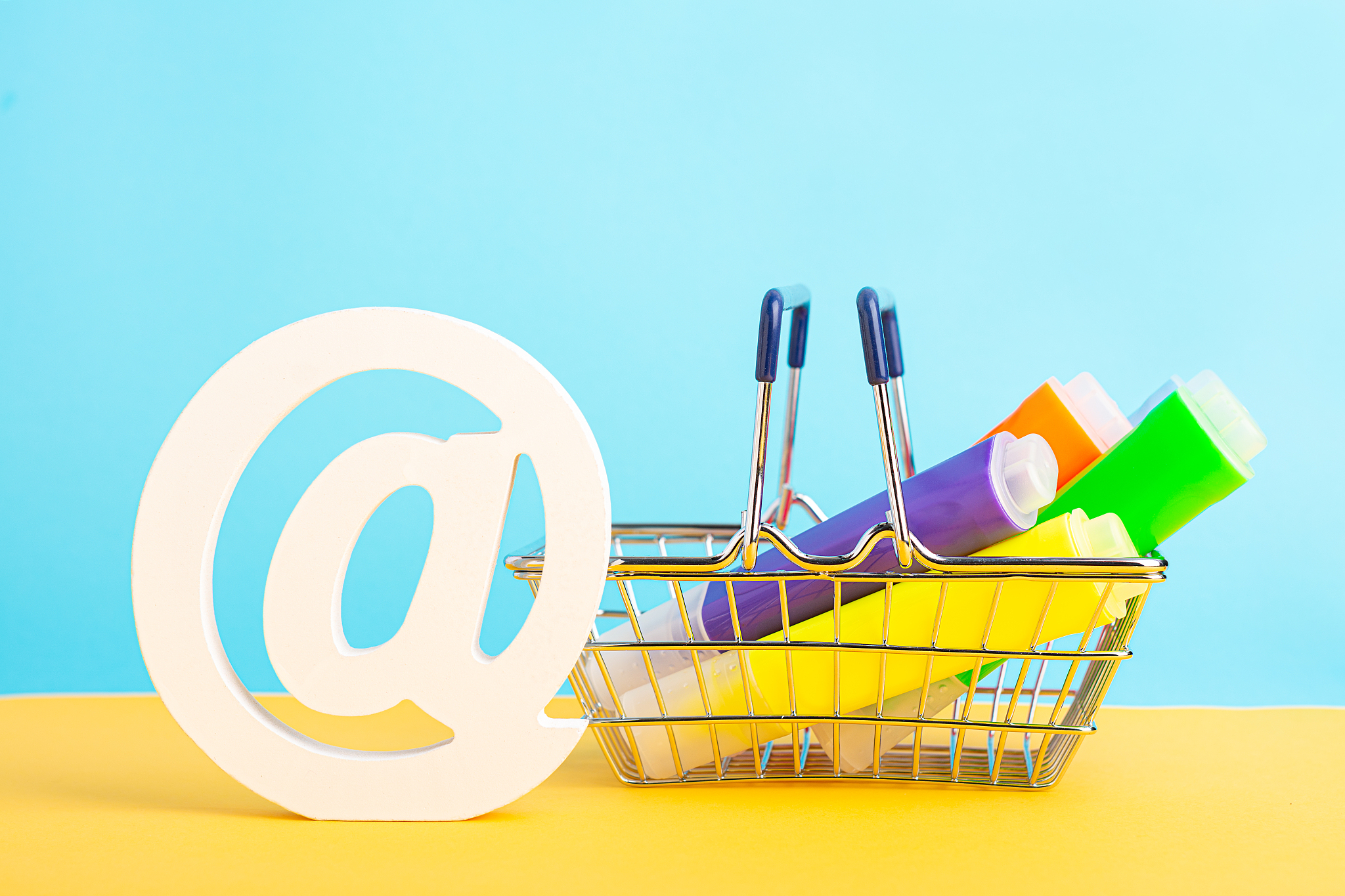 a shopping basket highlighter marker pen and at symbol or commer