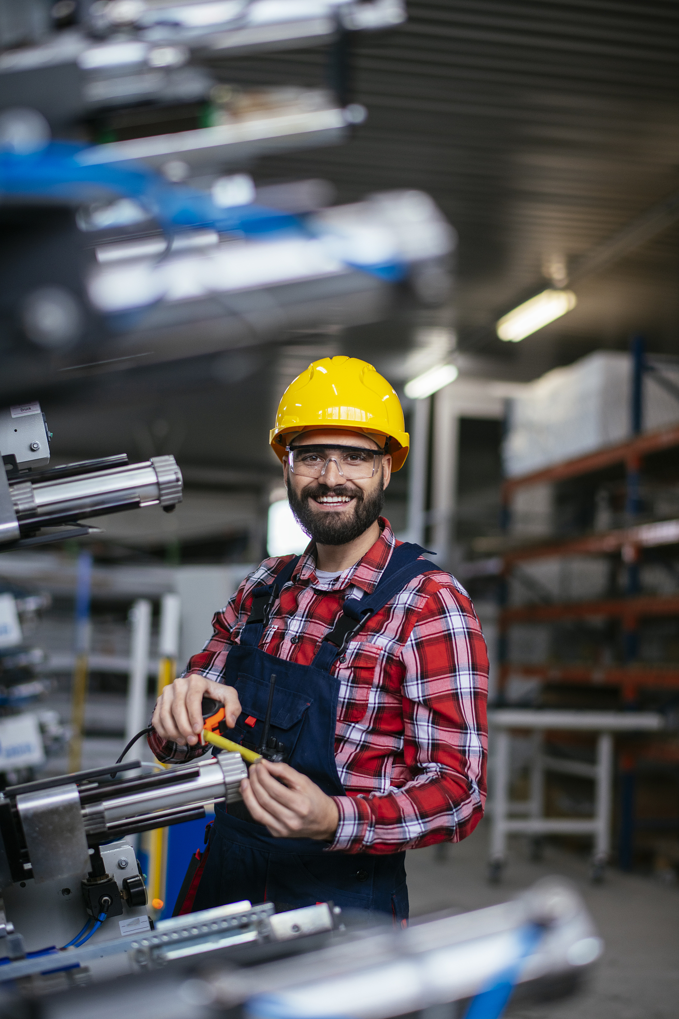 worker in factory on machine