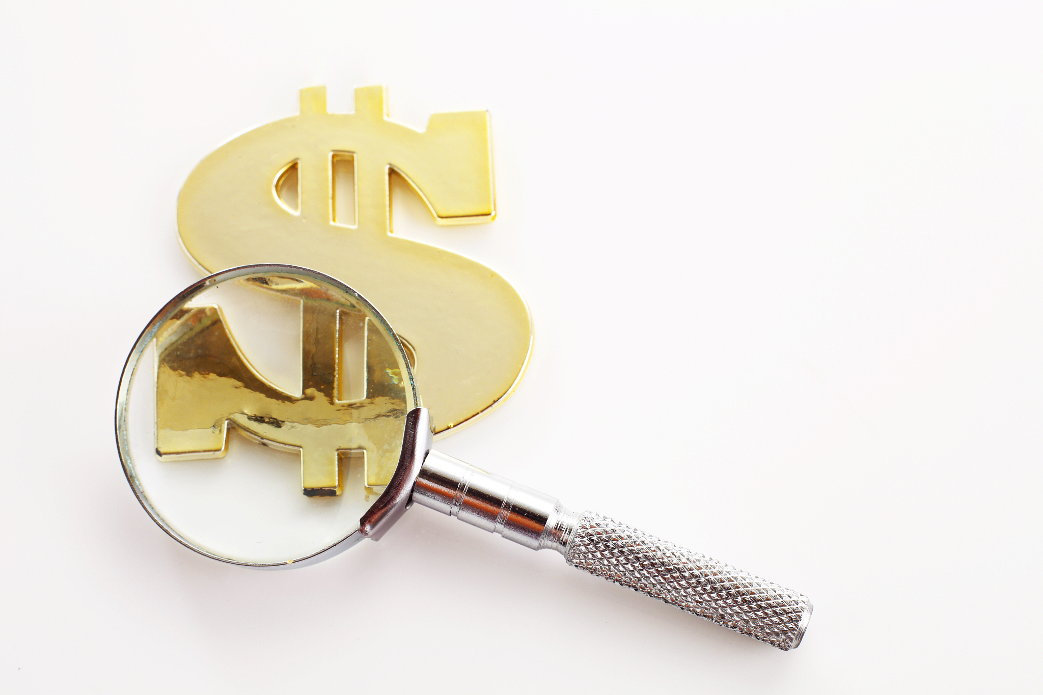 high angle view of magnifying glass against white background