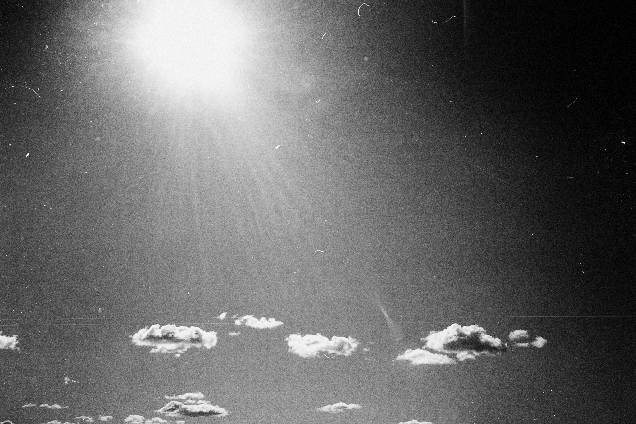 grunge image of sky with some clouds on grainy film texture