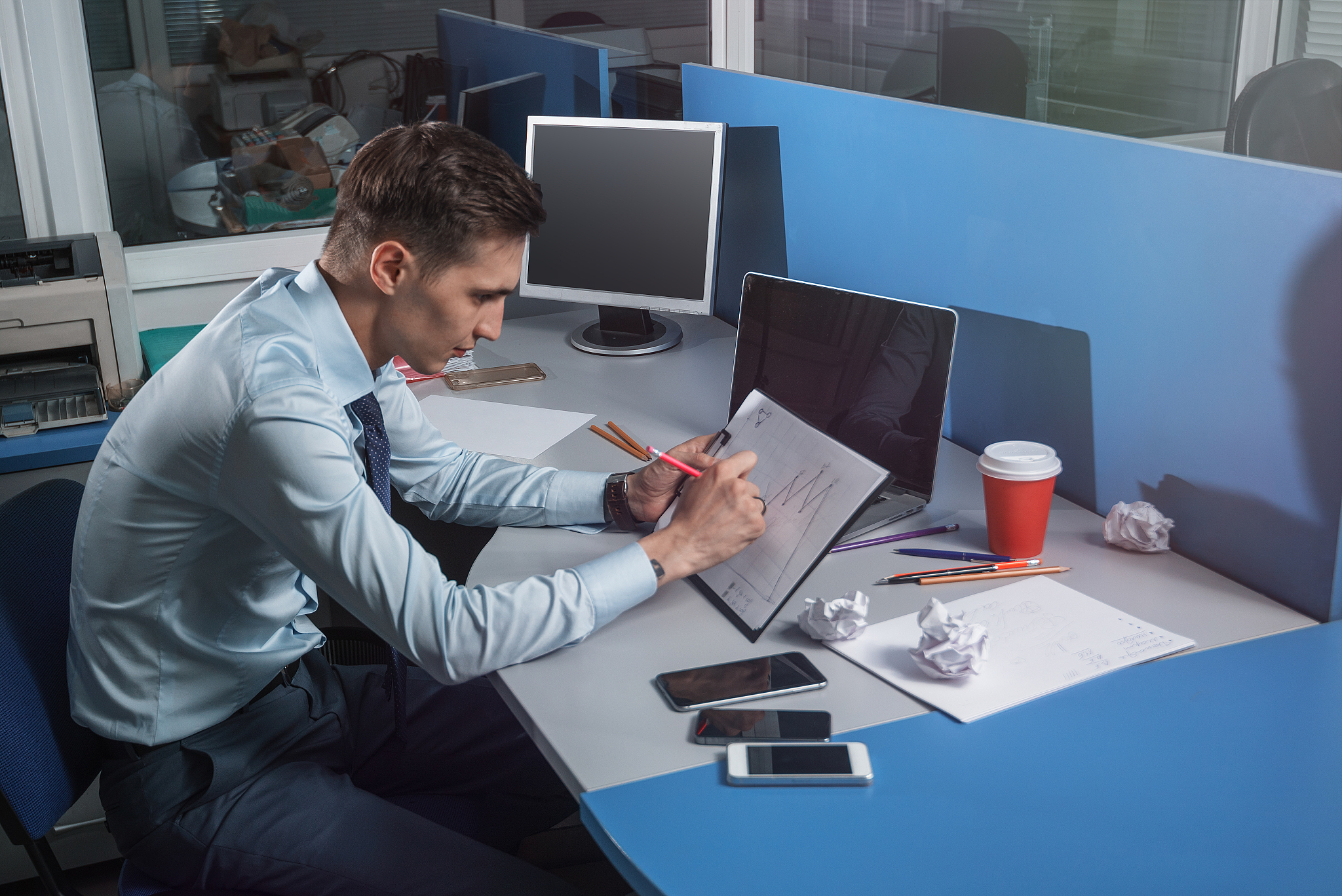 businessman draws graph