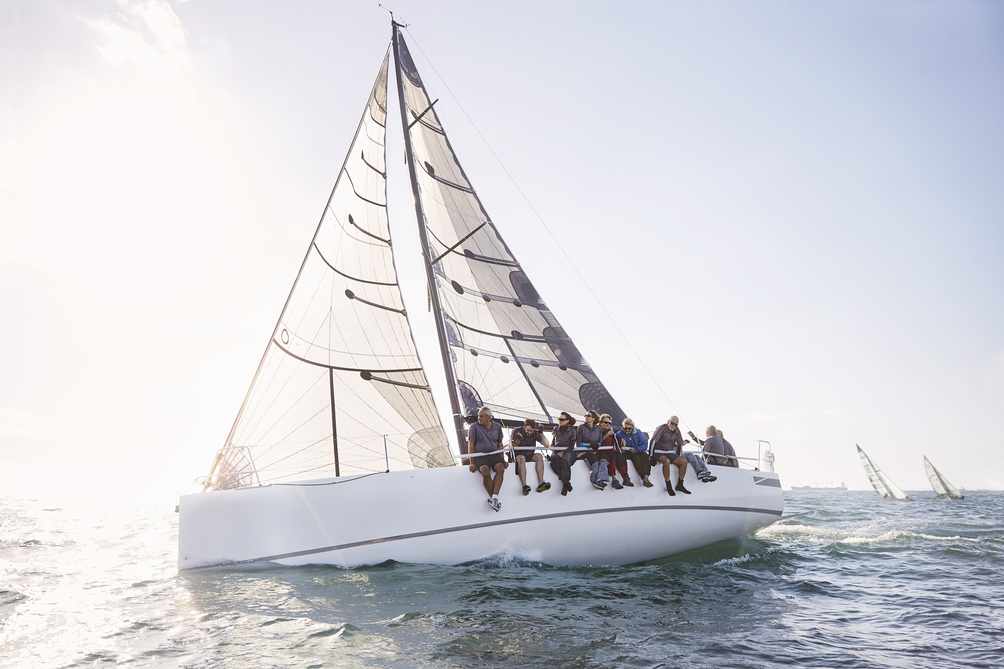 friends sailing on sunny ocean