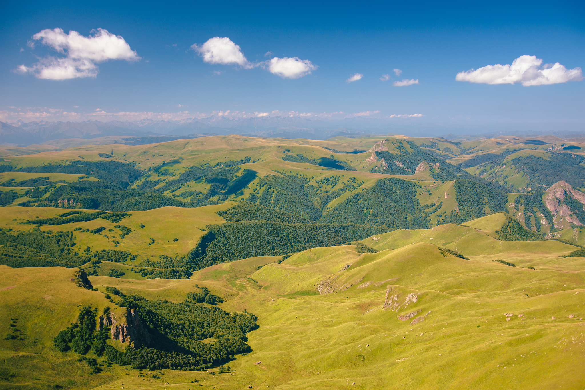 view from the bermamyt plateau on a summer day. hills and clouds