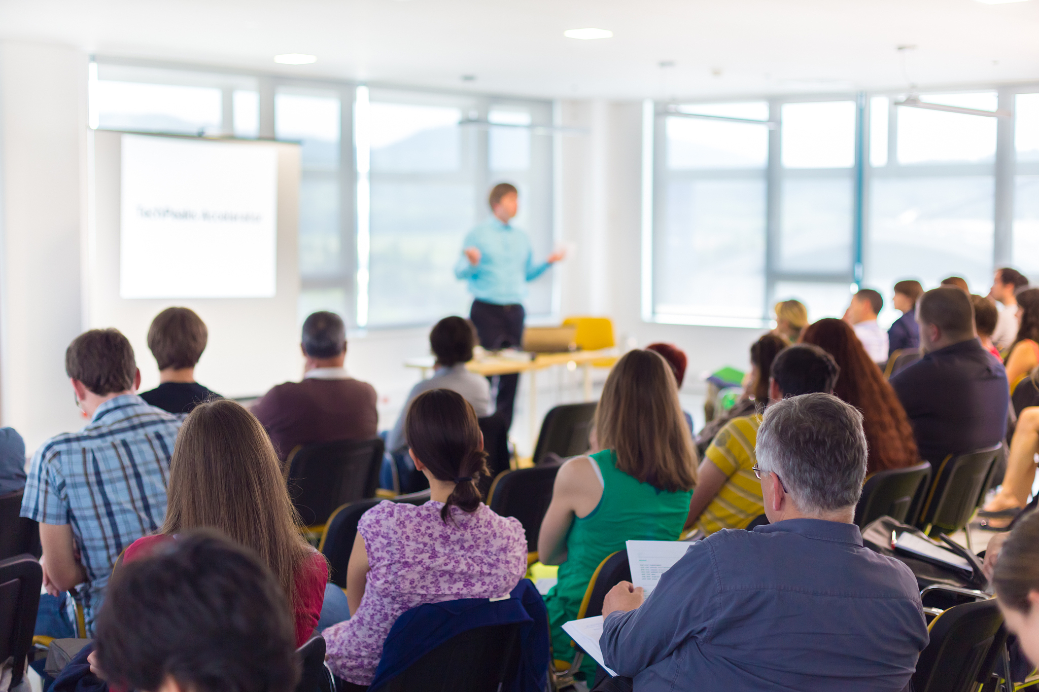 speaker at business convention and presentation.