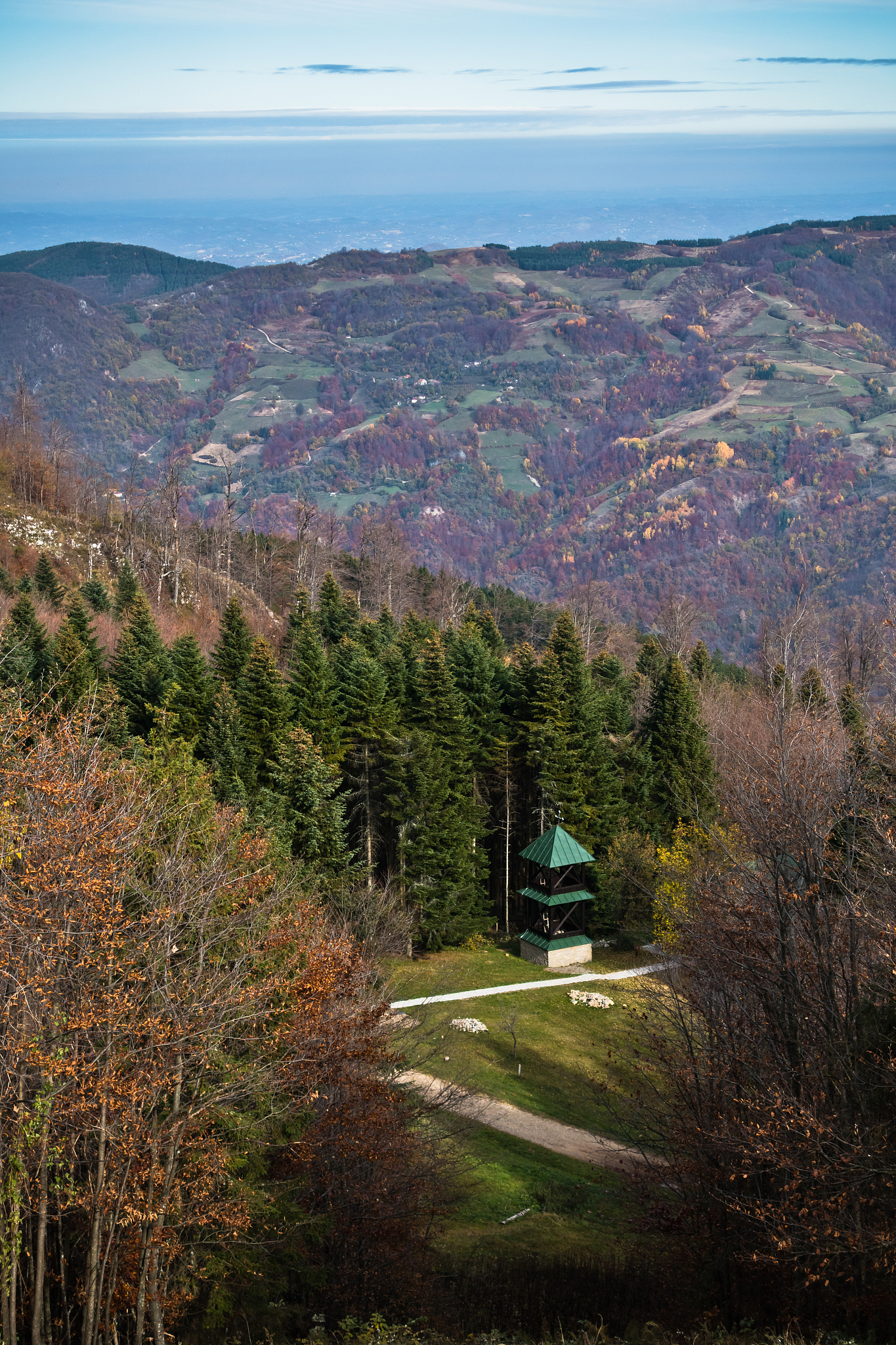 small church on a mountain meadow surrounded by forest