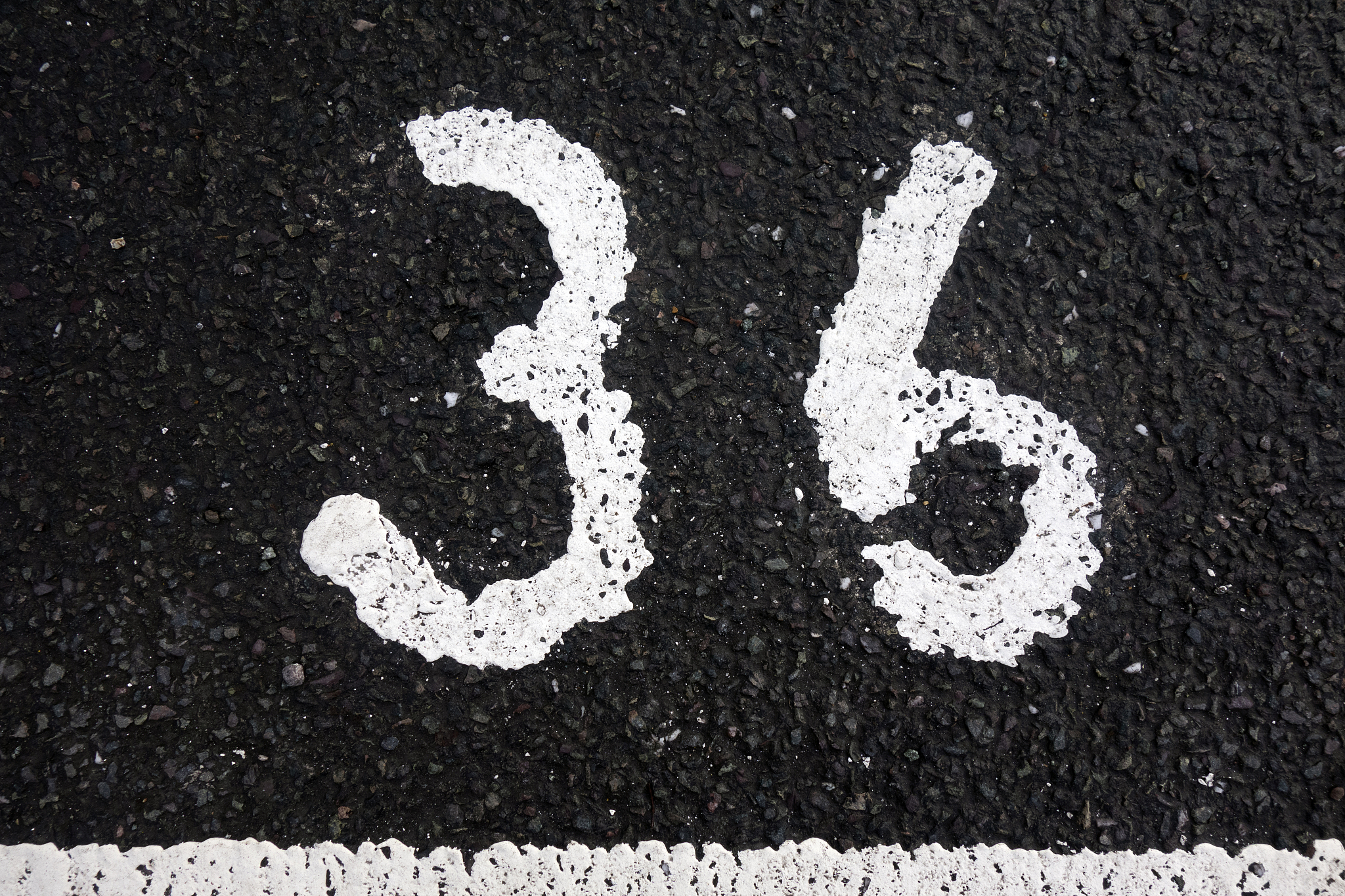 written wording in distressed state typography found number